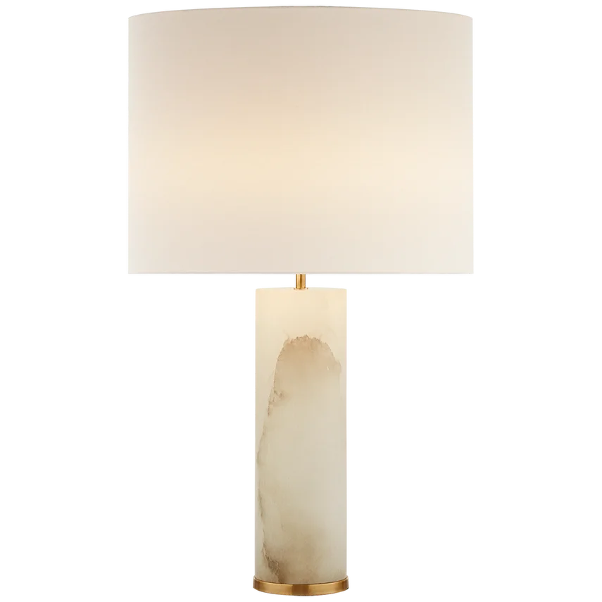 A table lamp with a white lampshade and a marble base.