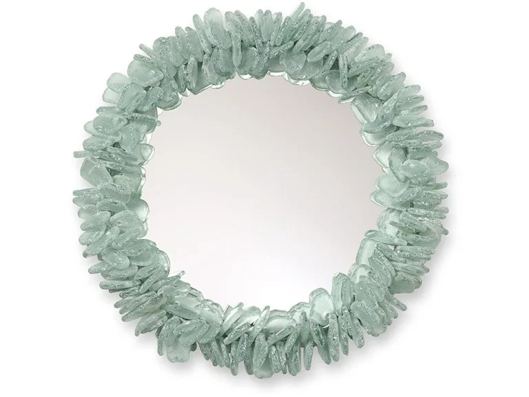 A round mirror surrounded by a frame of light green sea glass.