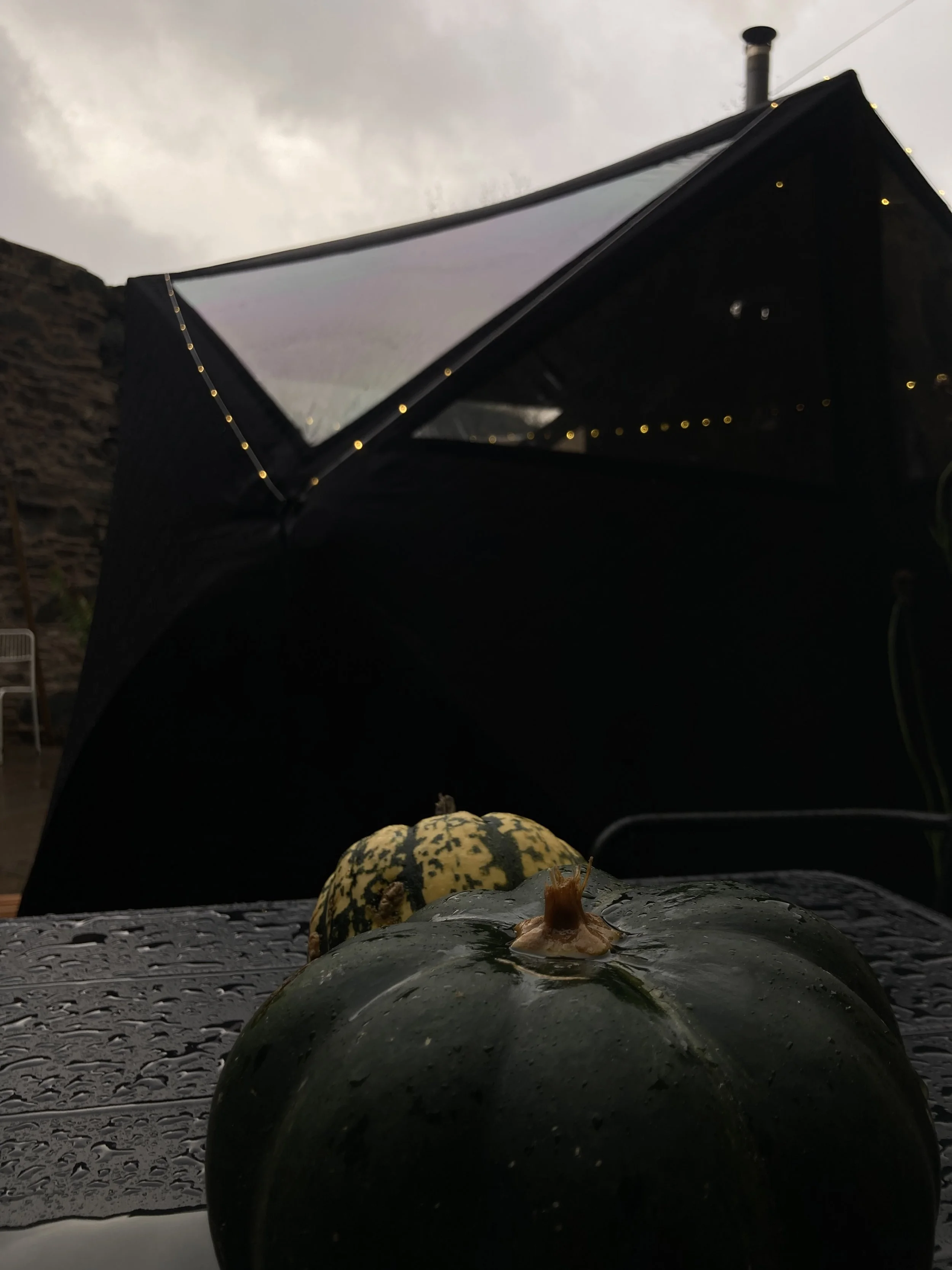 The rustic stone courtyard of Press Coffeeshop in Bute, prepped for the Bees Sauna September pop-up.