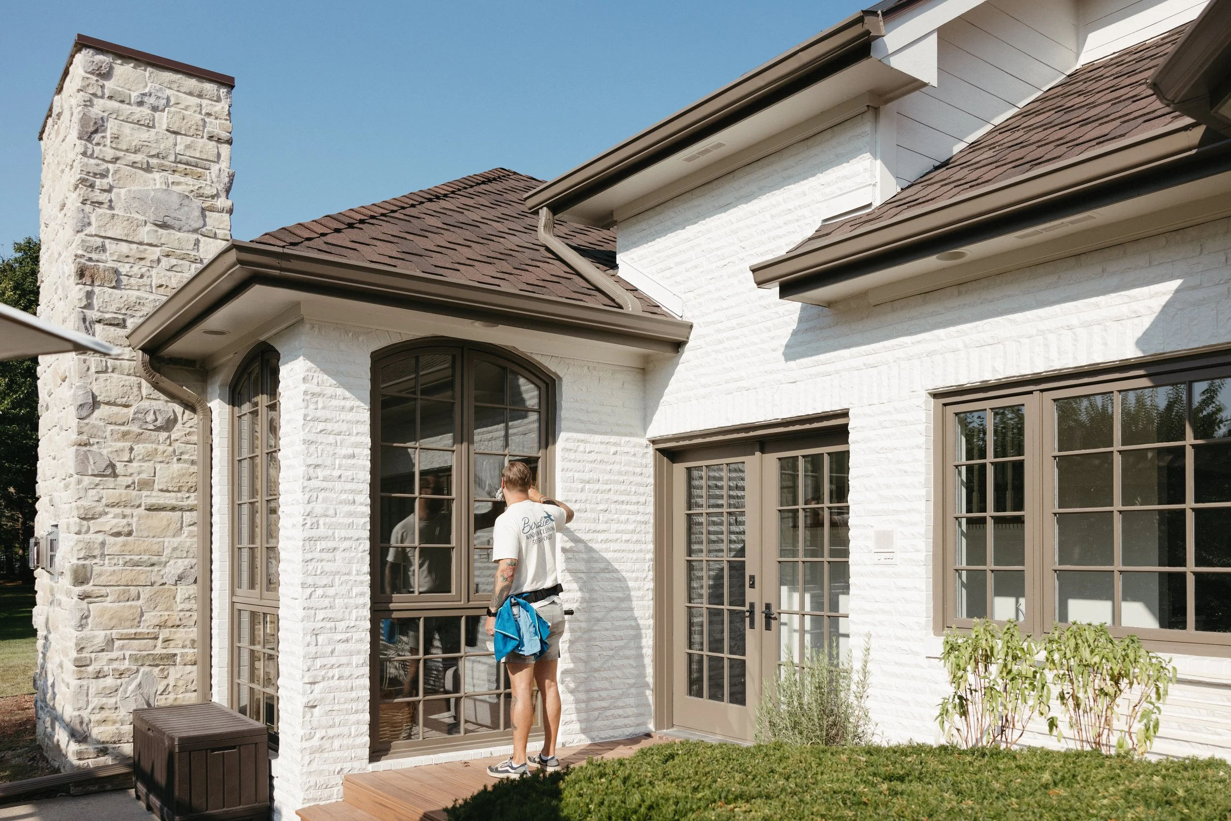 Birdie Window Cleaning team member delivering residential window cleaning service in Waukee, IA for clear, streak-free results.