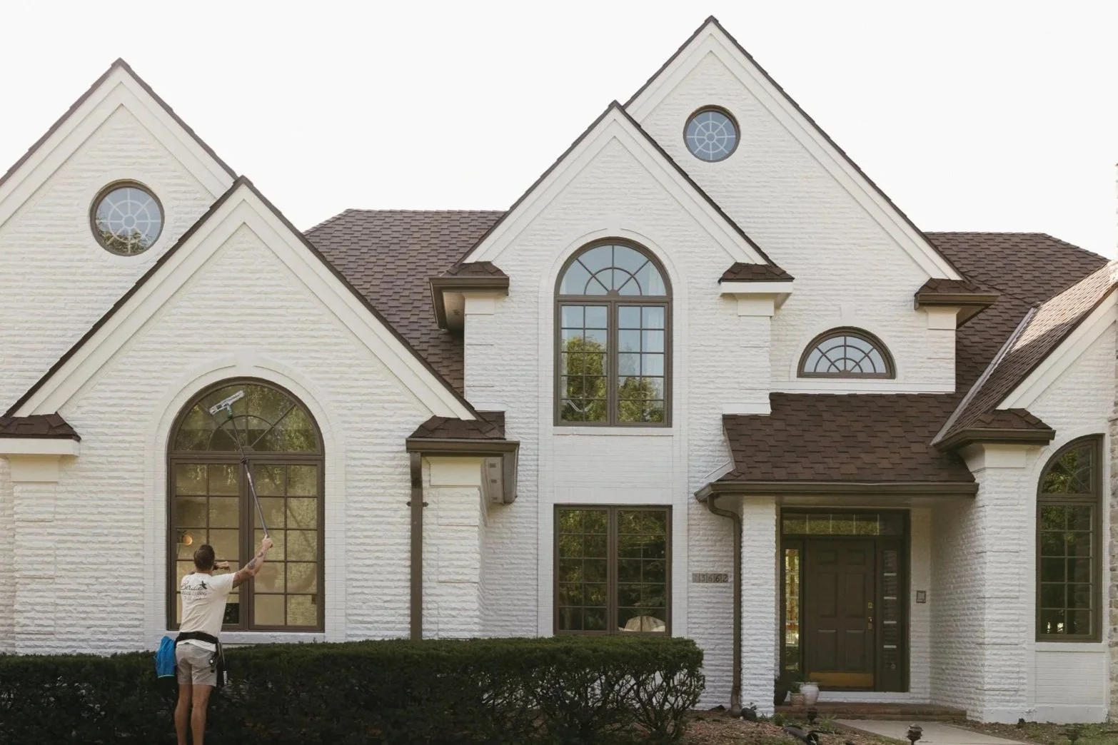 Birdie Window Cleaning professional cleaning residential window screens in Adel, IA for a neater appearance and clearer sightlines.