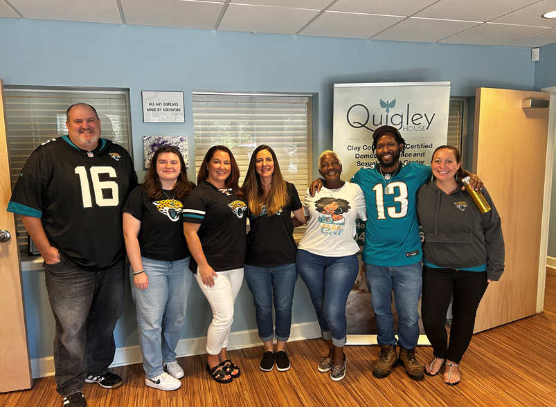 QH staff wearing Jaguars merch for the Jaguars Give & Go Program!