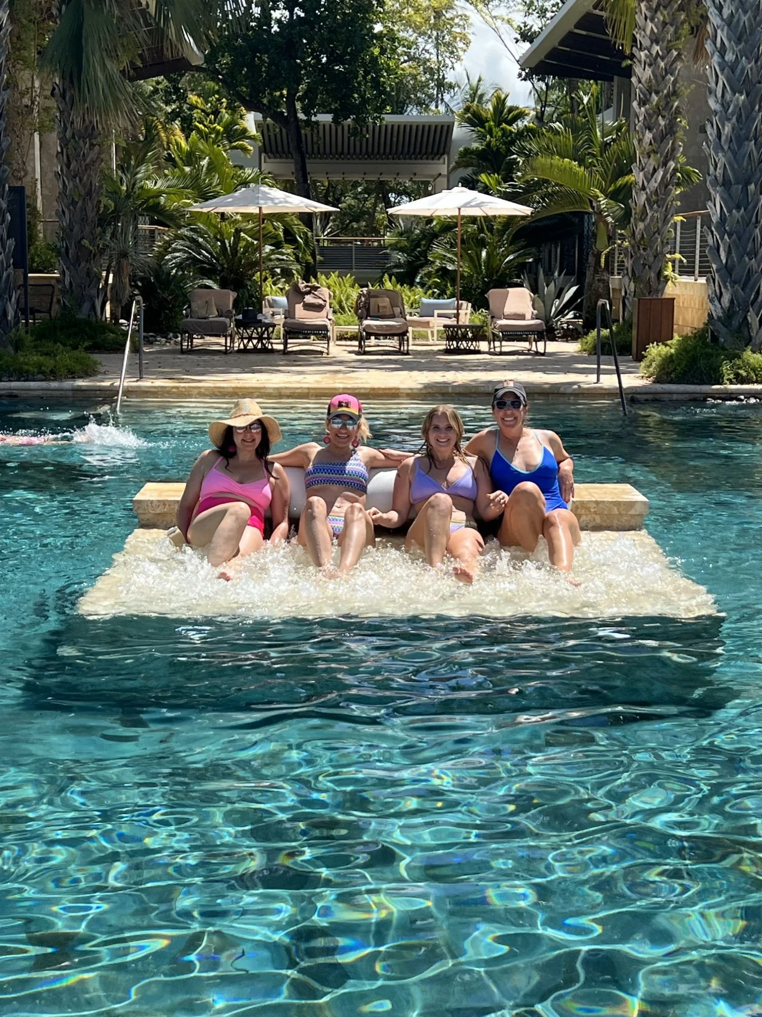 Life insurance agents in the pool on an incentive trip