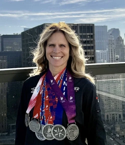 Julie Thornton Marathon medals.jpg