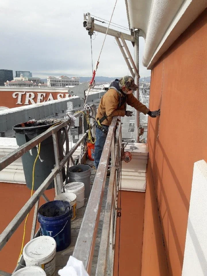 Exterior Joints being sealed by caulking