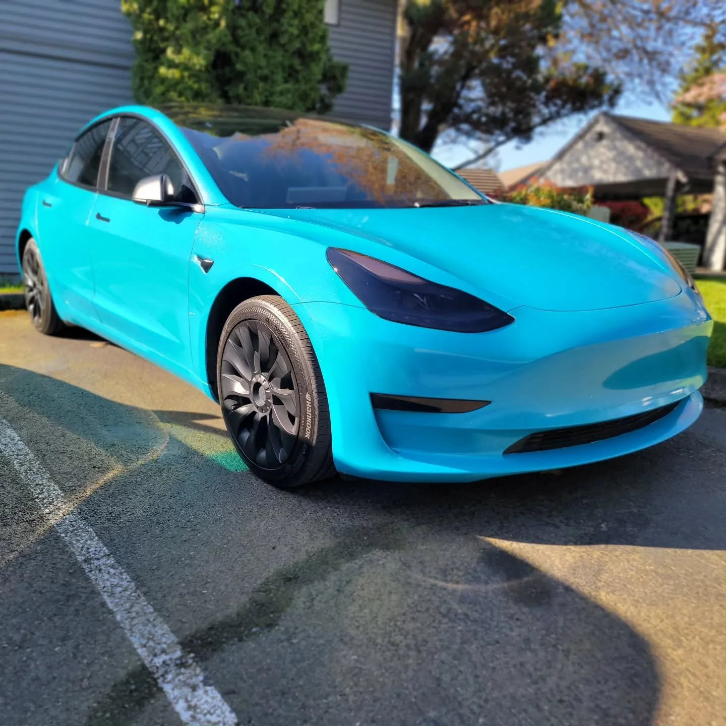 Model 3 Wrapped in Miami Blue Sparkle from #auravinyl  20% Tint all around. Dark smoke LPF from #stek #autoaestheticpnw