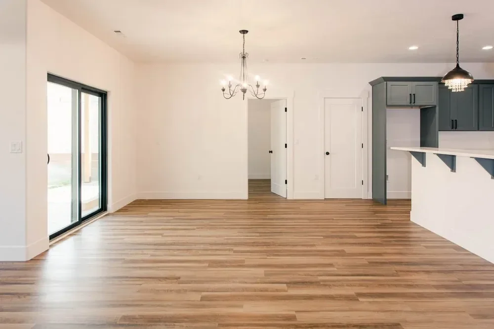 Custom warm modern home with wood textures, matte black fixtures, and transitional-style finishes throughout — built by Verity Construction.