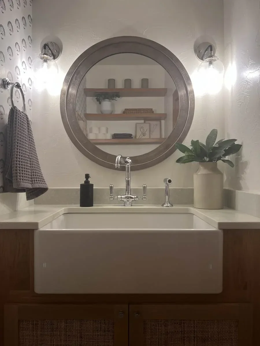Modern home renovation featuring warm wood cabinetry, hex tile flooring, textured shower walls, and neutral-toned interiors in Southern Oregon, completed by Verity Construction.