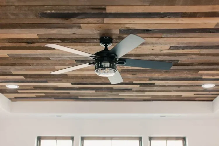 Custom warm modern home with wood textures, matte black fixtures, and transitional-style finishes throughout — built by Verity Construction.