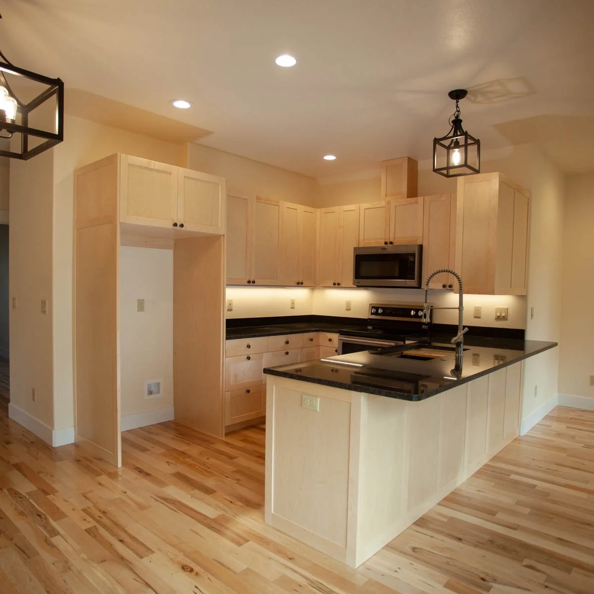Open concept kitchen with center island, built by Verity Construction in Southern Oregon.

