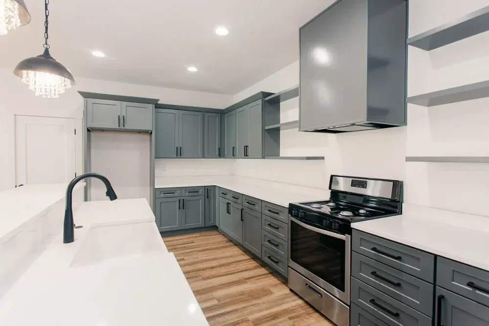 Custom warm modern home with wood textures, matte black fixtures, and transitional-style finishes throughout — built by Verity Construction.