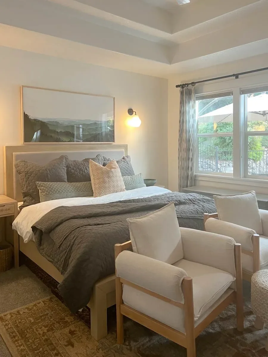 Modern home renovation featuring warm wood cabinetry, hex tile flooring, textured shower walls, and neutral-toned interiors in Southern Oregon, completed by Verity Construction.