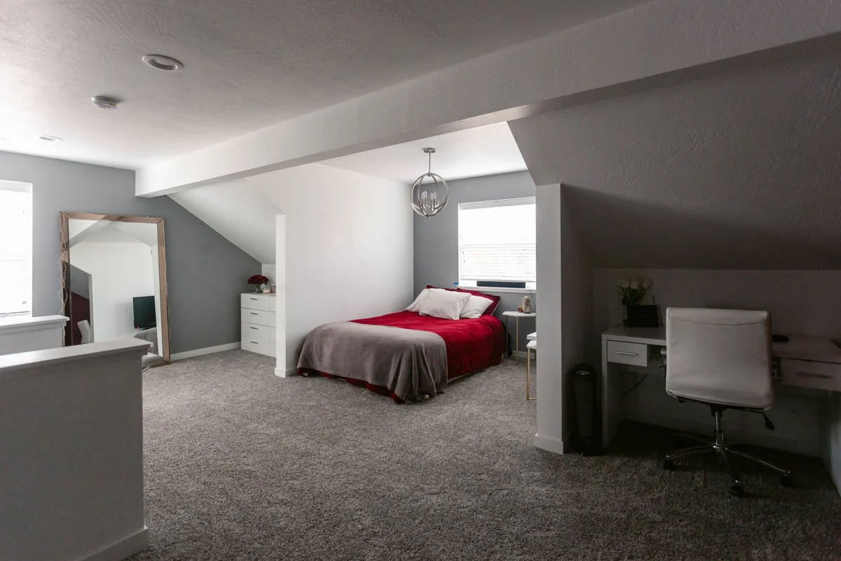 Upstairs attic bedroom with home office nook, remodeled by Verity Construction.