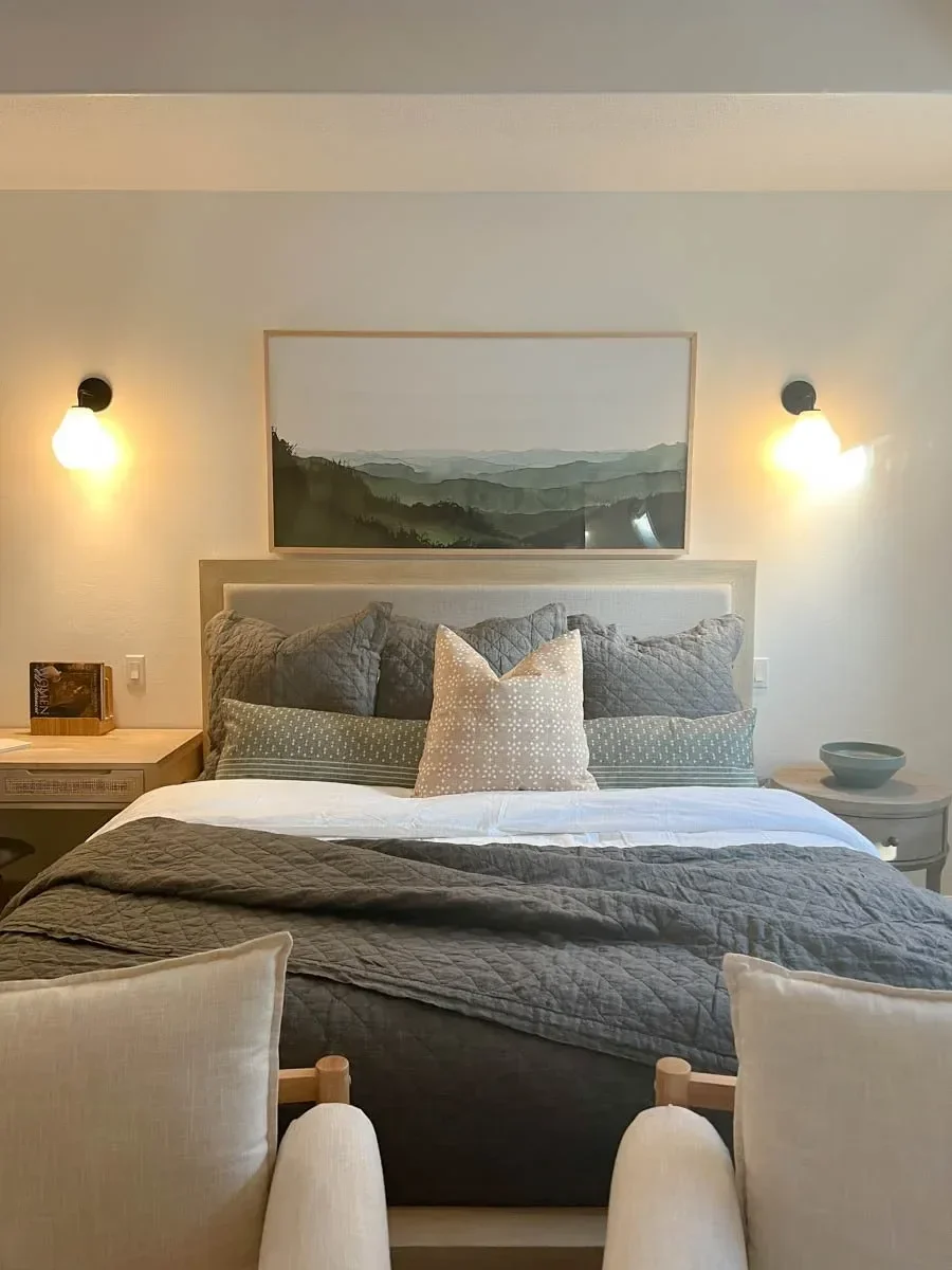 Modern home renovation featuring warm wood cabinetry, hex tile flooring, textured shower walls, and neutral-toned interiors in Southern Oregon, completed by Verity Construction.