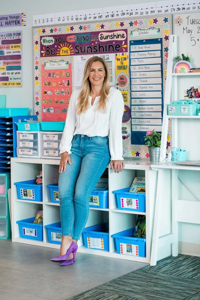 Karen Lara, educational consultant and teacher coach, standing in elementary classroom smiling.
