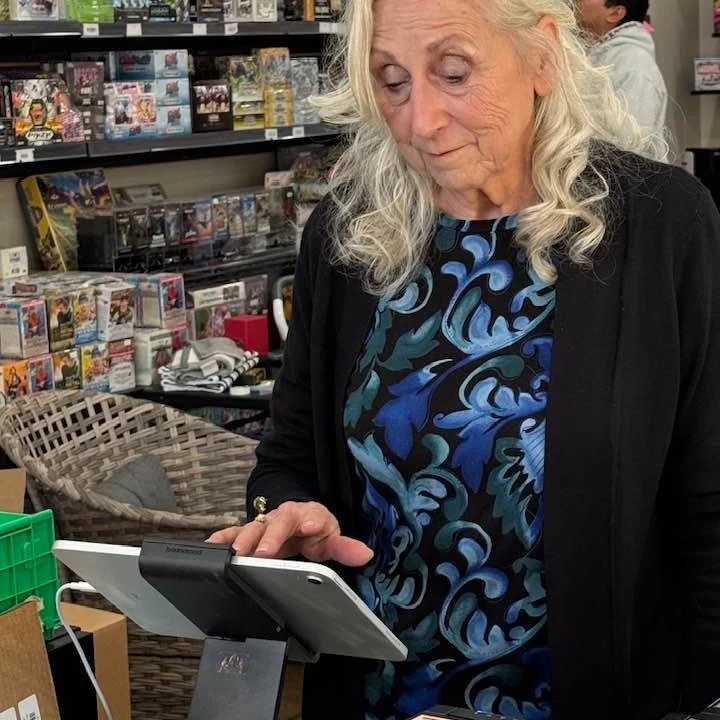 Moma Ferguson hard at work today at Ferguson Brothers Cards &mdash; keeping the shop running, keeping us in line, and proving once again that nobody hustles harder than her. ❤️
Grateful for all she does for the store and our community. Come say hi ne