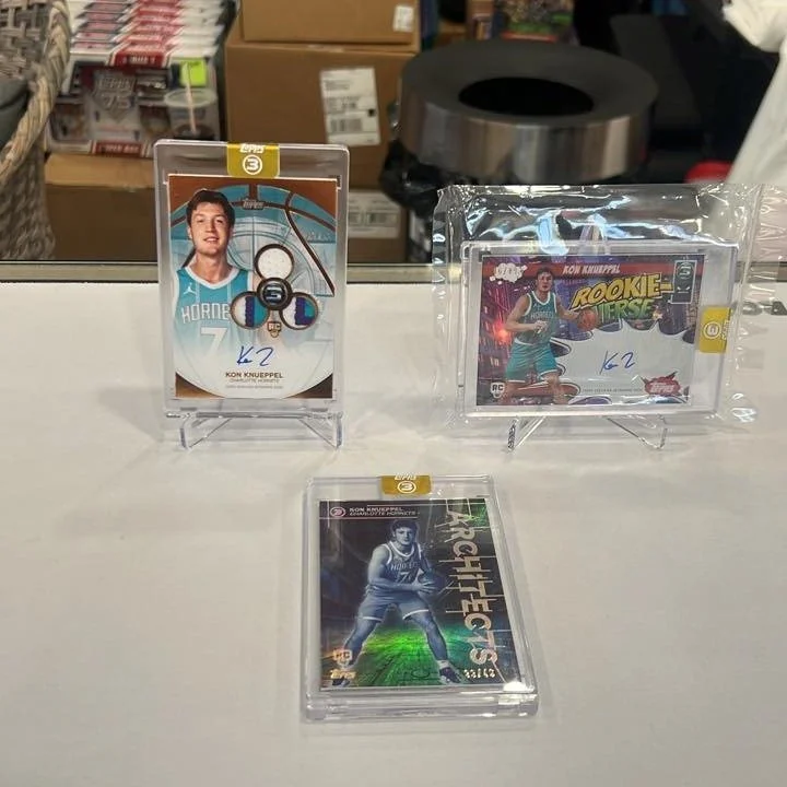 🔥 BIG KON NIGHT at Ferguson Brothers Cards 🔥

The new Topps Series 3 has been absolutely loaded, and these three Kon Knueppel pulls prove it! Sitting on the counter are three incredible hits including a Rookie Relic Auto (RPA) numbered to 25, a Roo