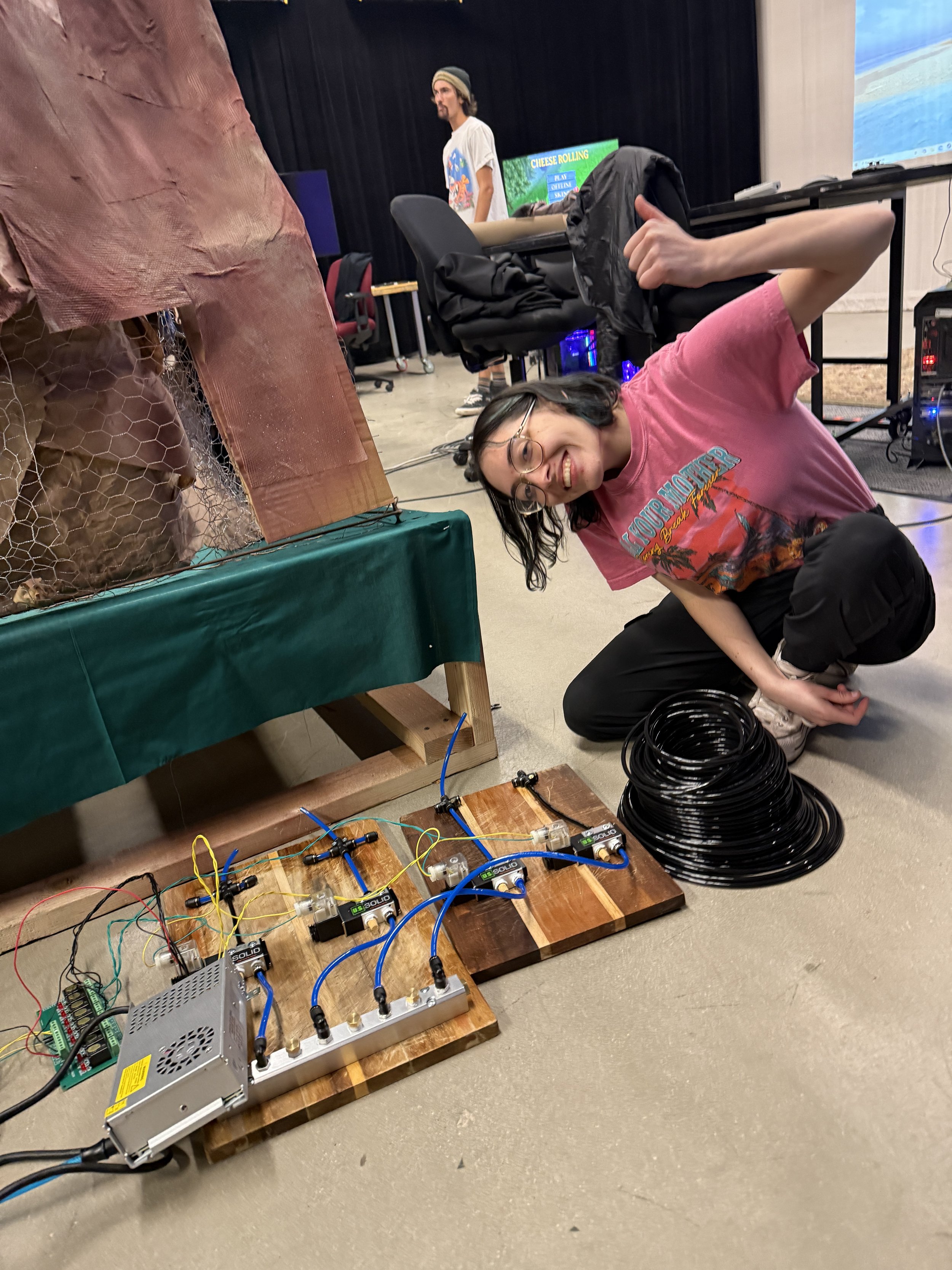 girl sits on floor installing a project