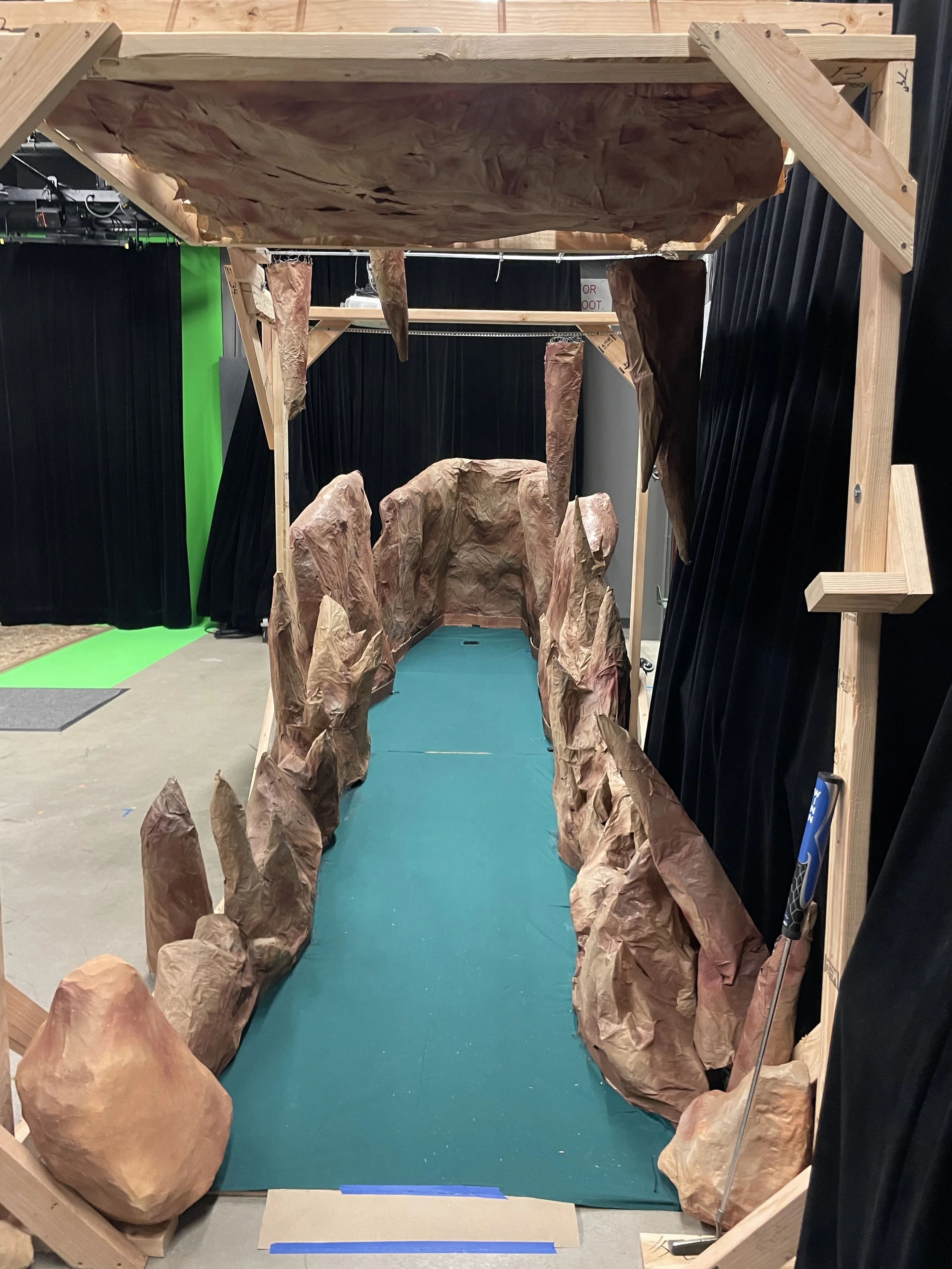 a front view of a mini-golf hole