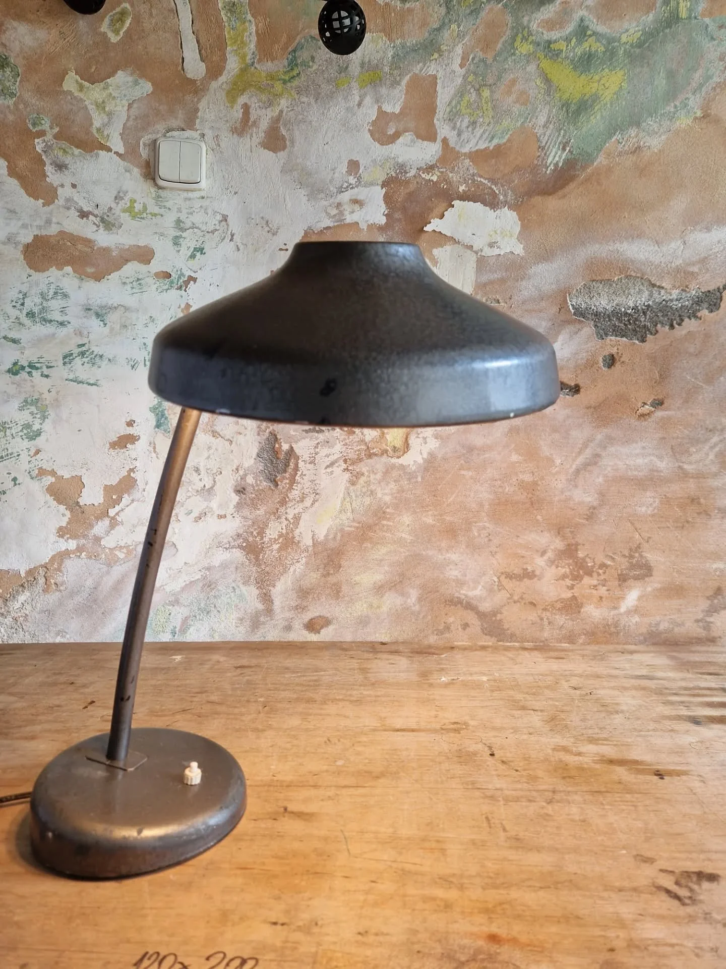Ready for takeoff? 🛸

Meet this iconic 1940s &quot;flying saucer&quot; desk lamp, a true design marvel.
Originally crafted for bustling student accommodations, its distinctive form and robust build made it a staple.
Now, this unique piece is ready t