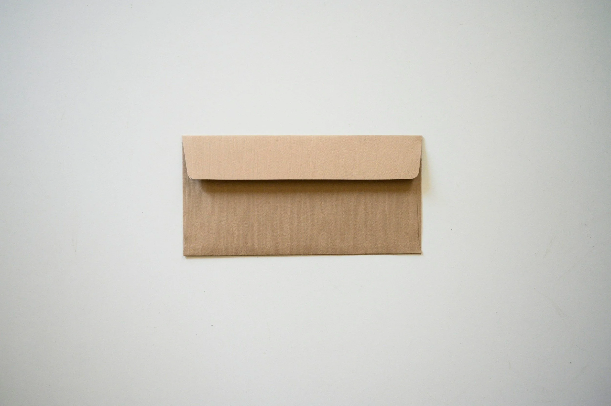 Brown envelope on white background