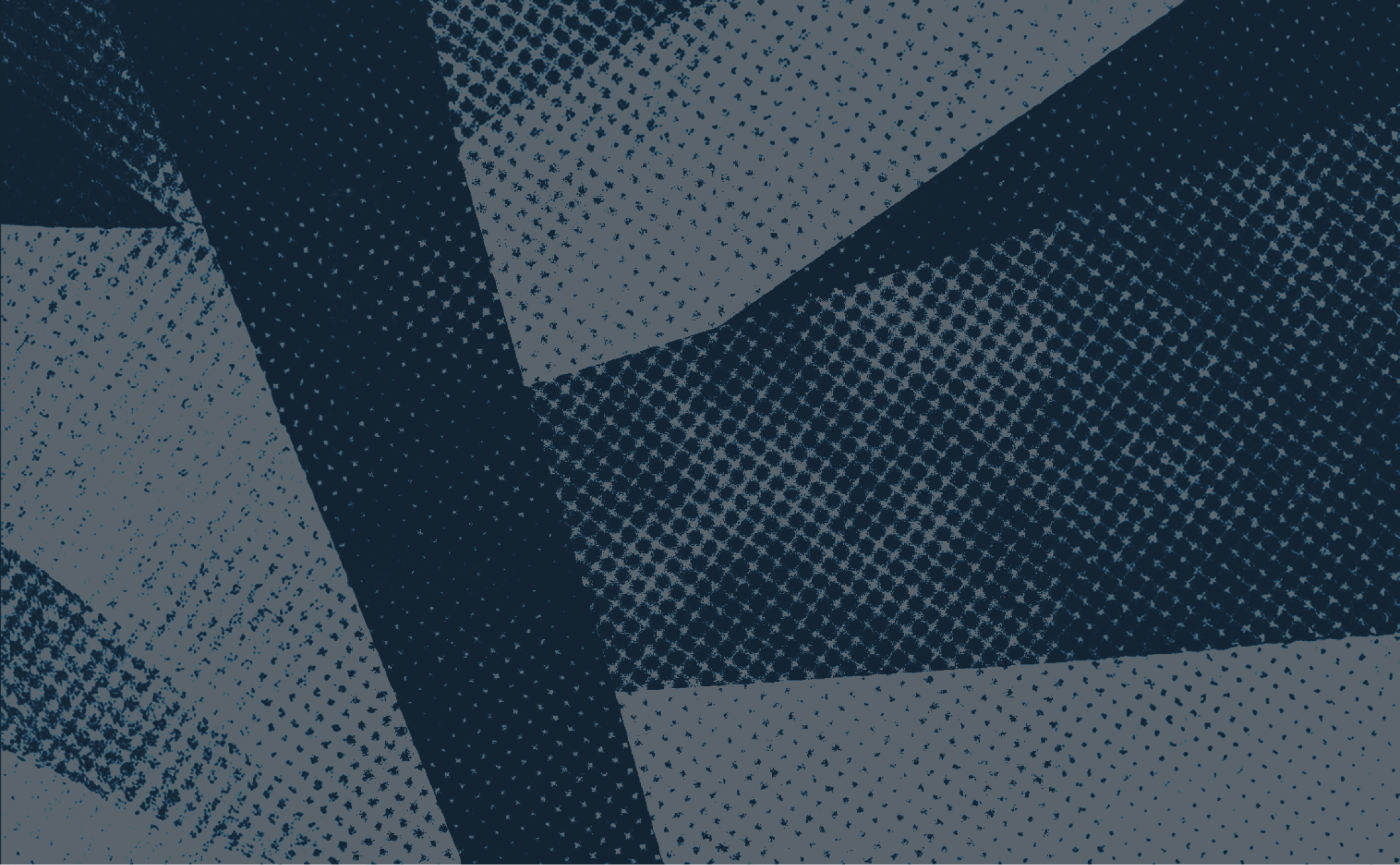 Close-up of textured, patterned fabric in dark blue and light gray with a dotted and crosshatched design.