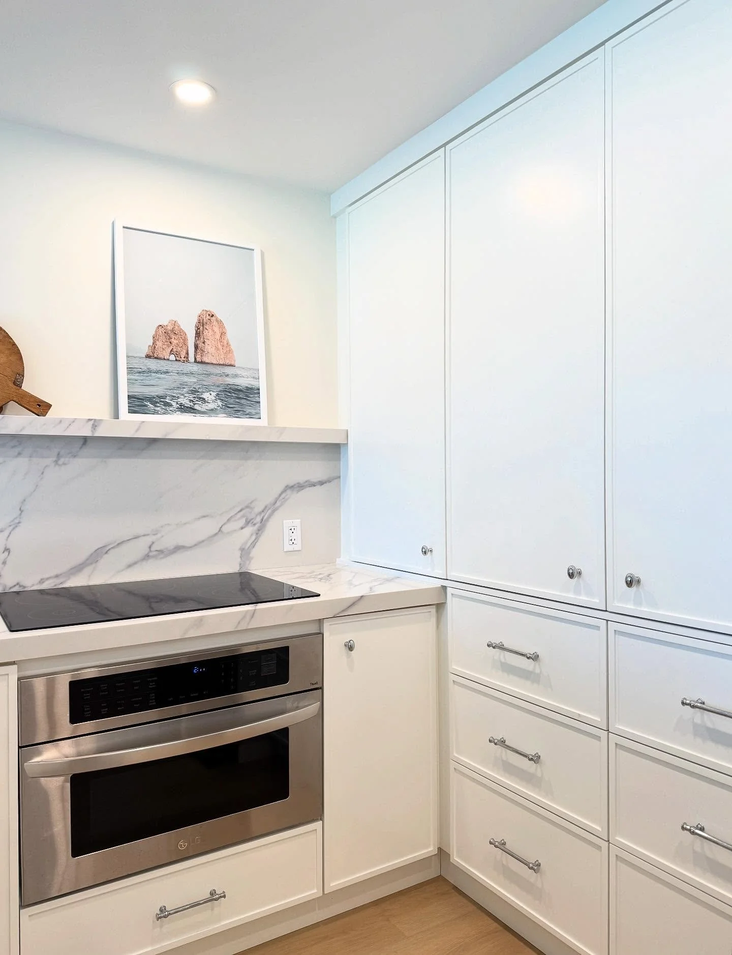 Upper cabinets aren&rsquo;t always the solution&mdash;especially if you&rsquo;ve got a lot of stuff.

By designing one wall with full-height cabinetry, you can hide everything (small appliances, pantry items, even that random Tupperware collection) a