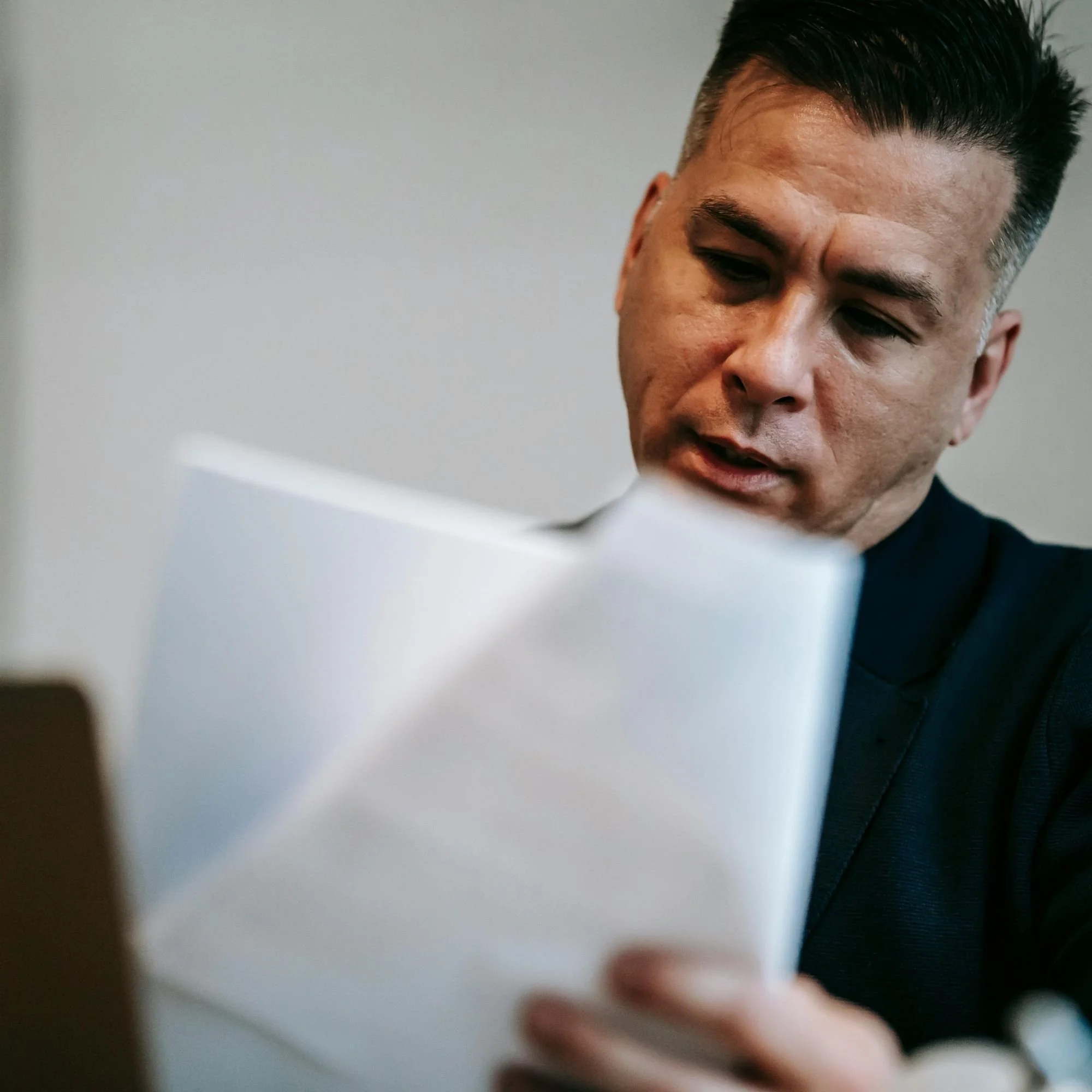 Real estate appraiser reviewing documents during valuation analysis