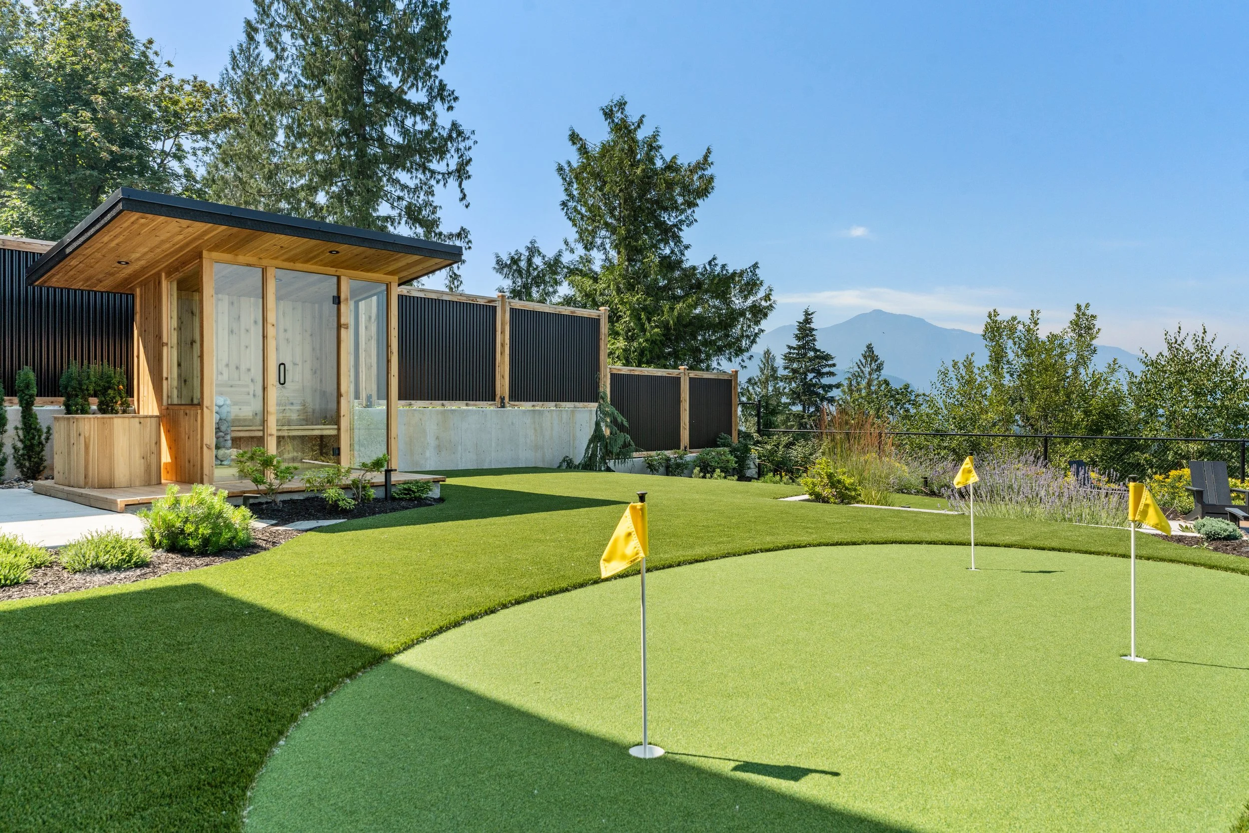 Backyard with a golf greens and sauna