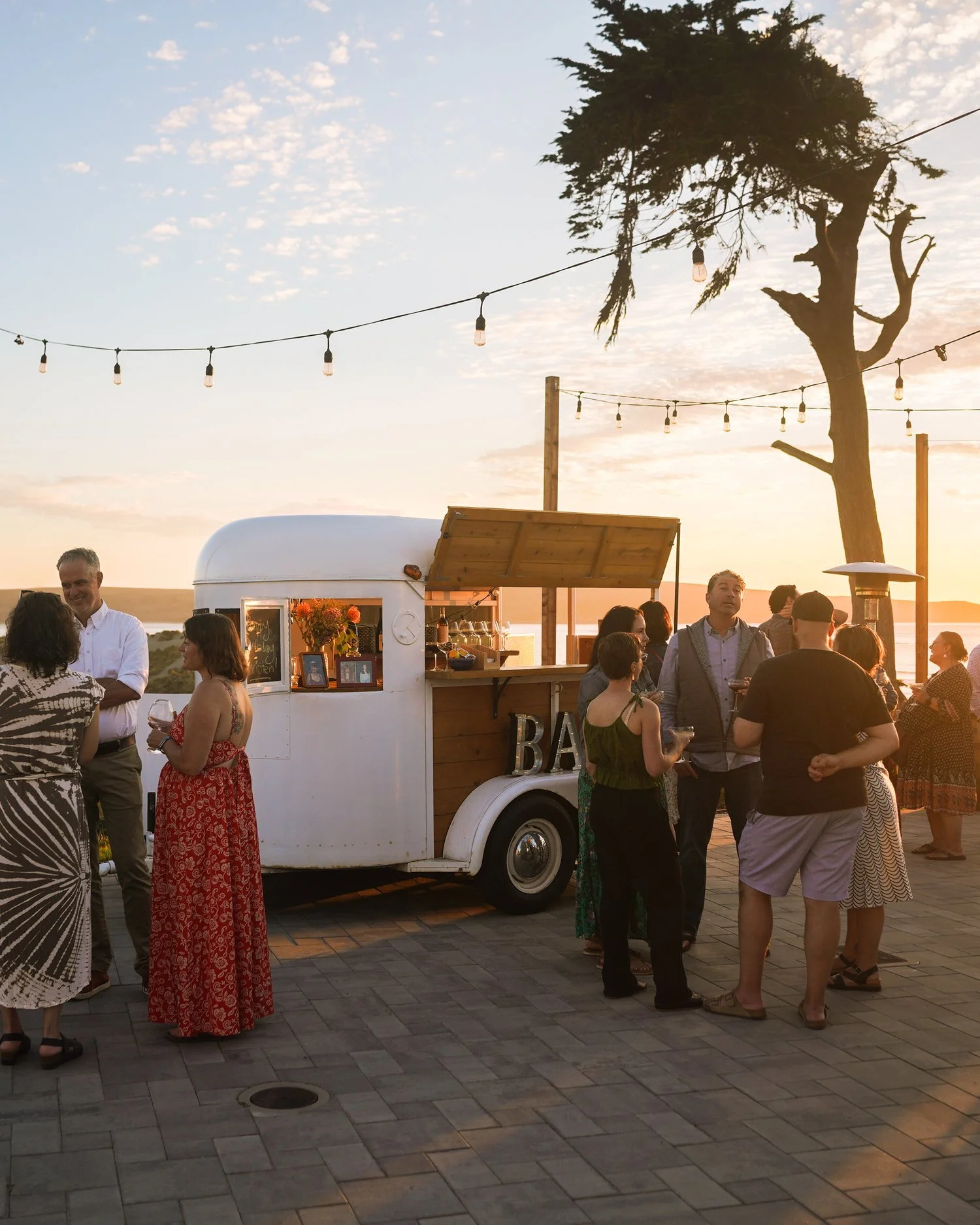Coastal wedding reception with mobile bar