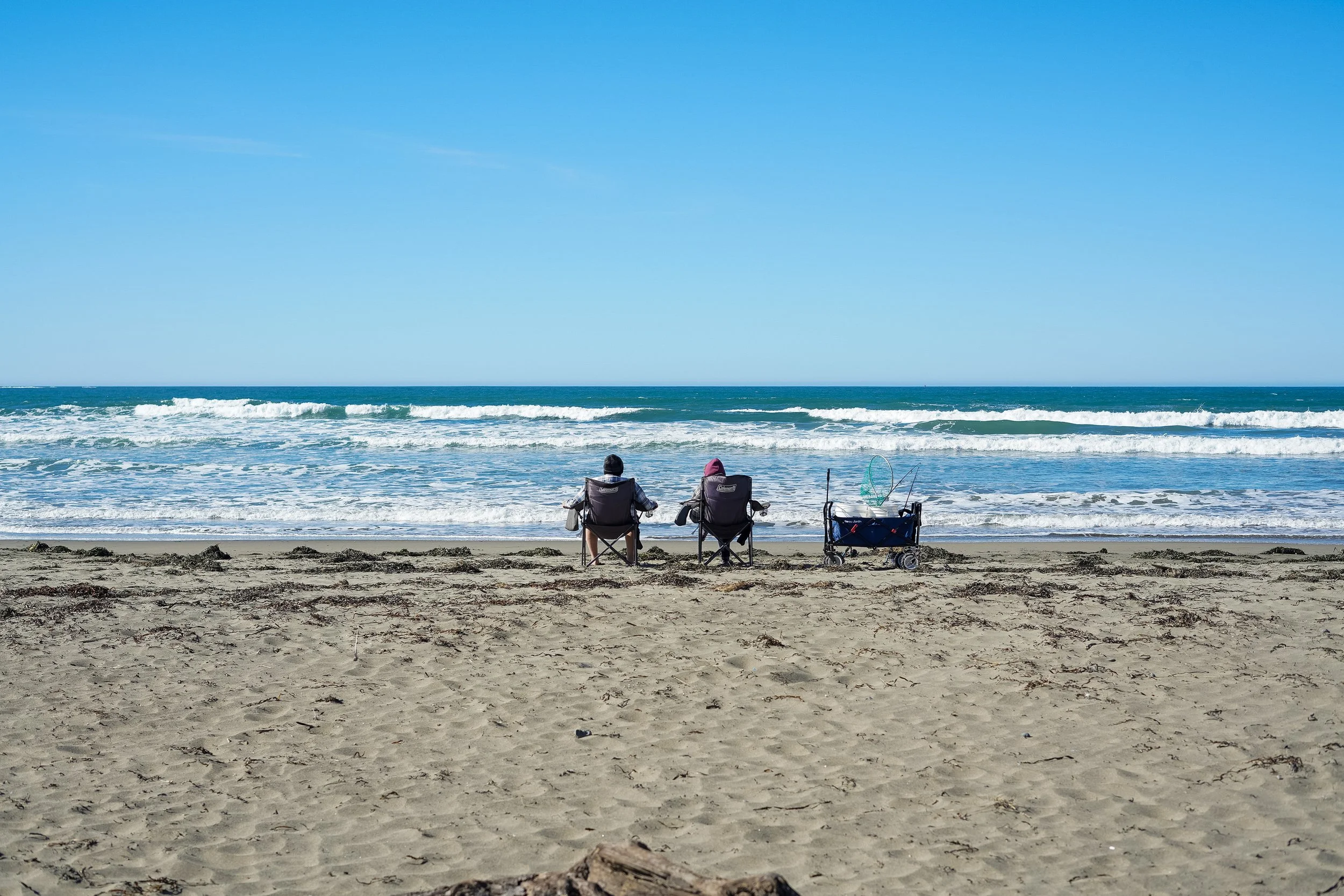 Relaxing in beach chairs at Dillon Beach