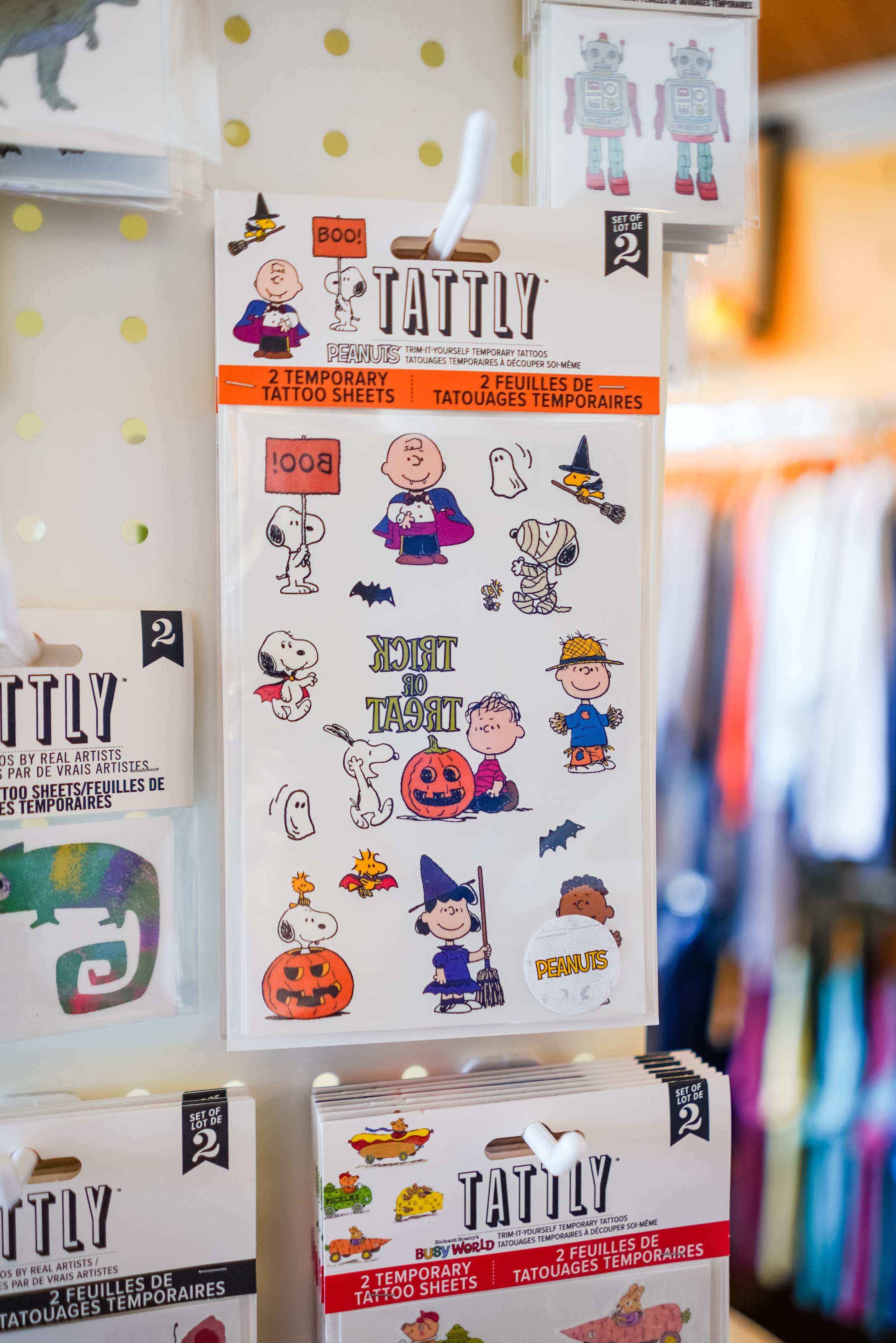 Set of Peanuts themed temporary tattoo sheets featuring characters like Charlie Brown, Snoopy, Woodstock, and others in Halloween costumes and themed designs.