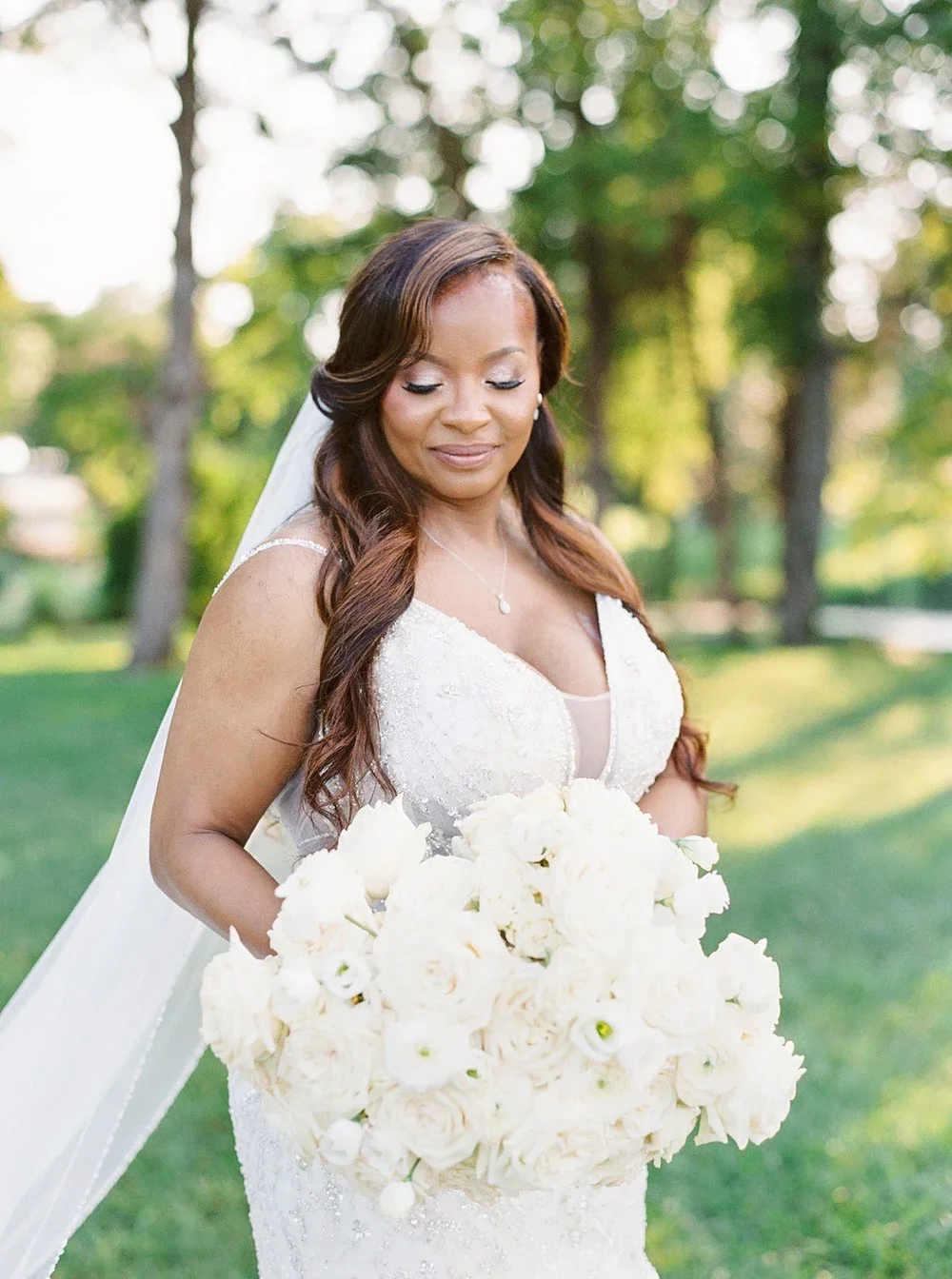 Bride and groom sharing a kiss beneath the veil in a soft romantic wedding portrait by Juicebeats Photography
