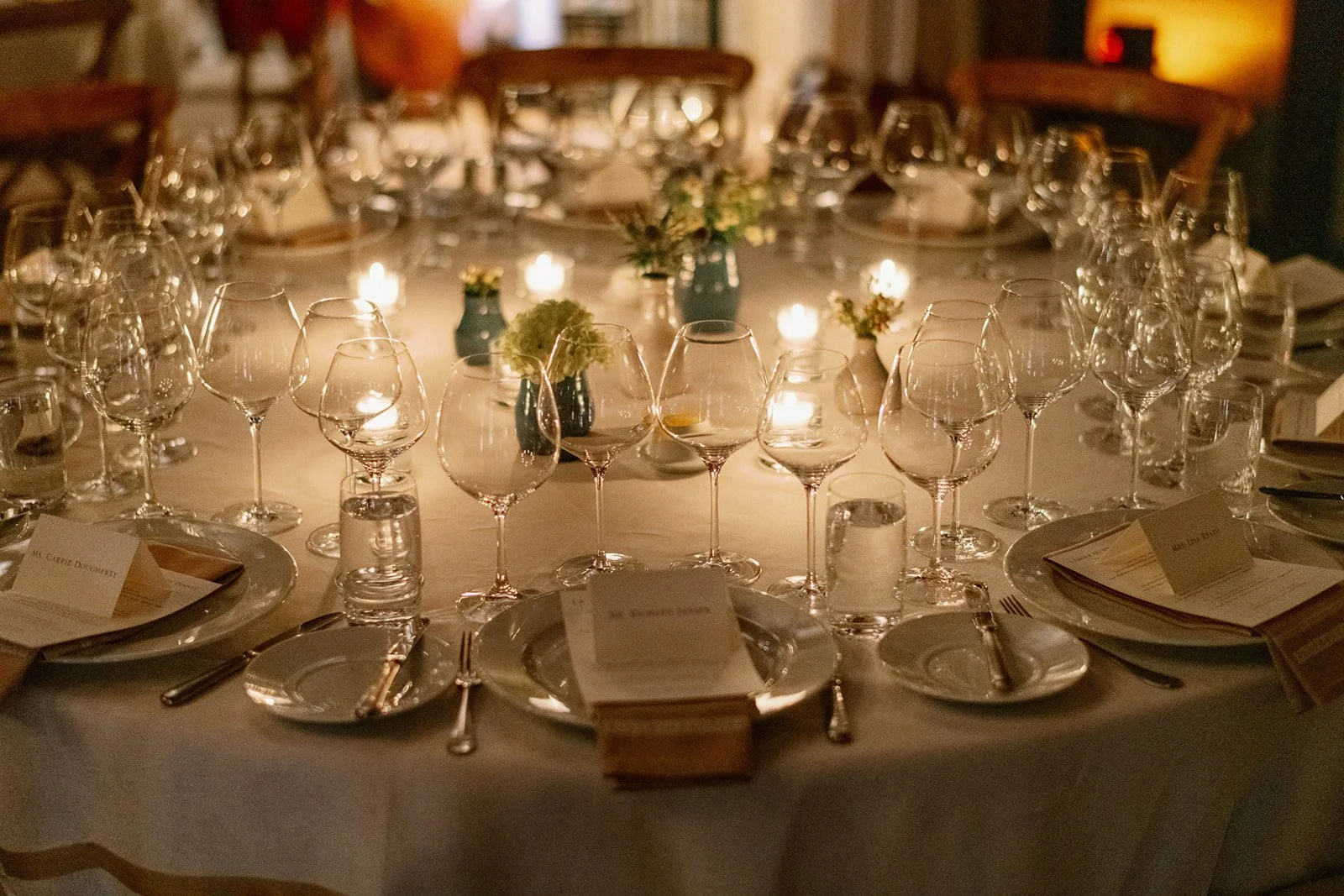 Elegant candlelit wedding reception table at Blackberry Farm in the Smoky Mountains with wine glasses, floral centerpieces, and warm ambient light