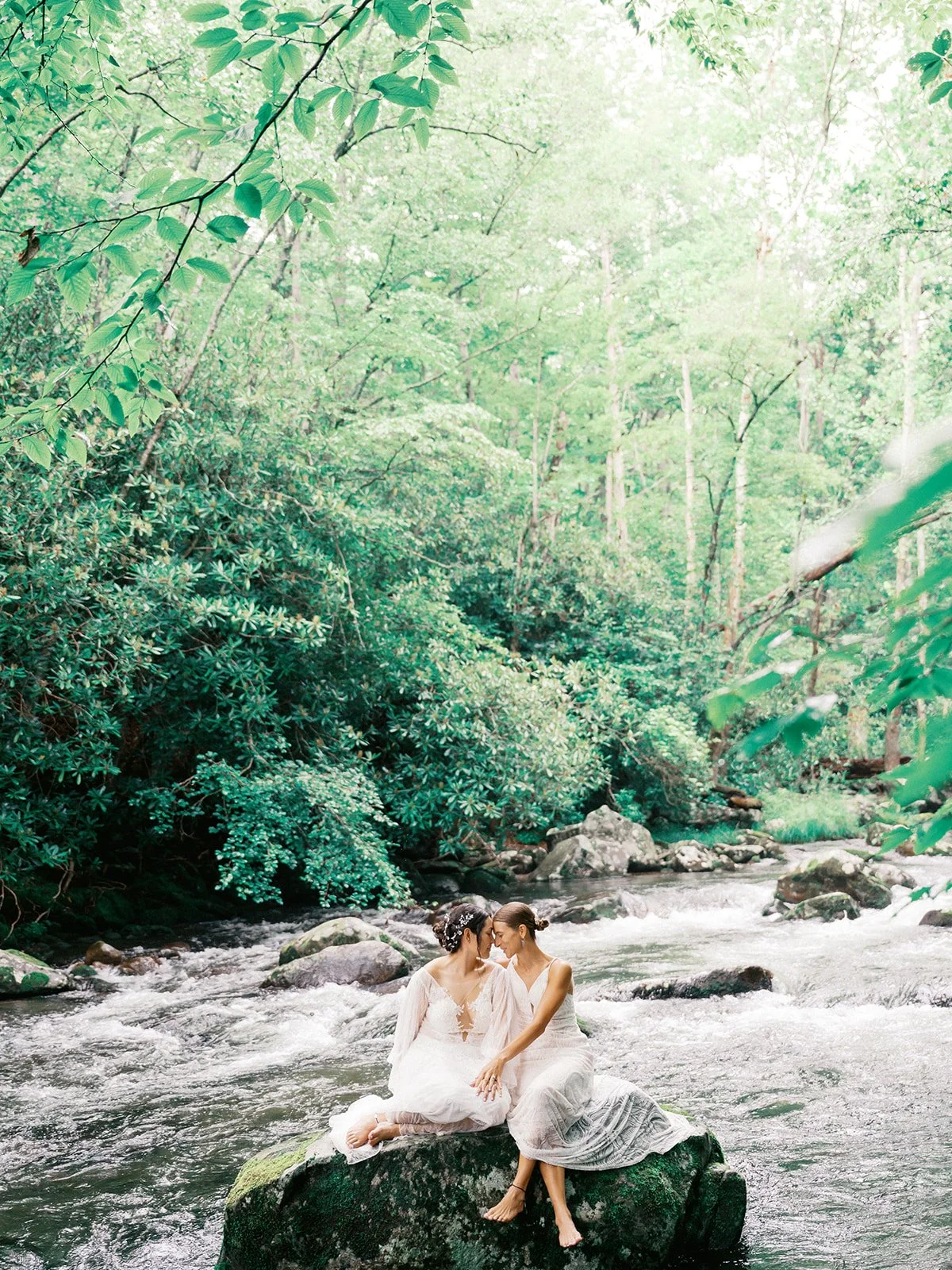 Wedding portrait by river in Elkmont area of Great Smoky Mountains National Park