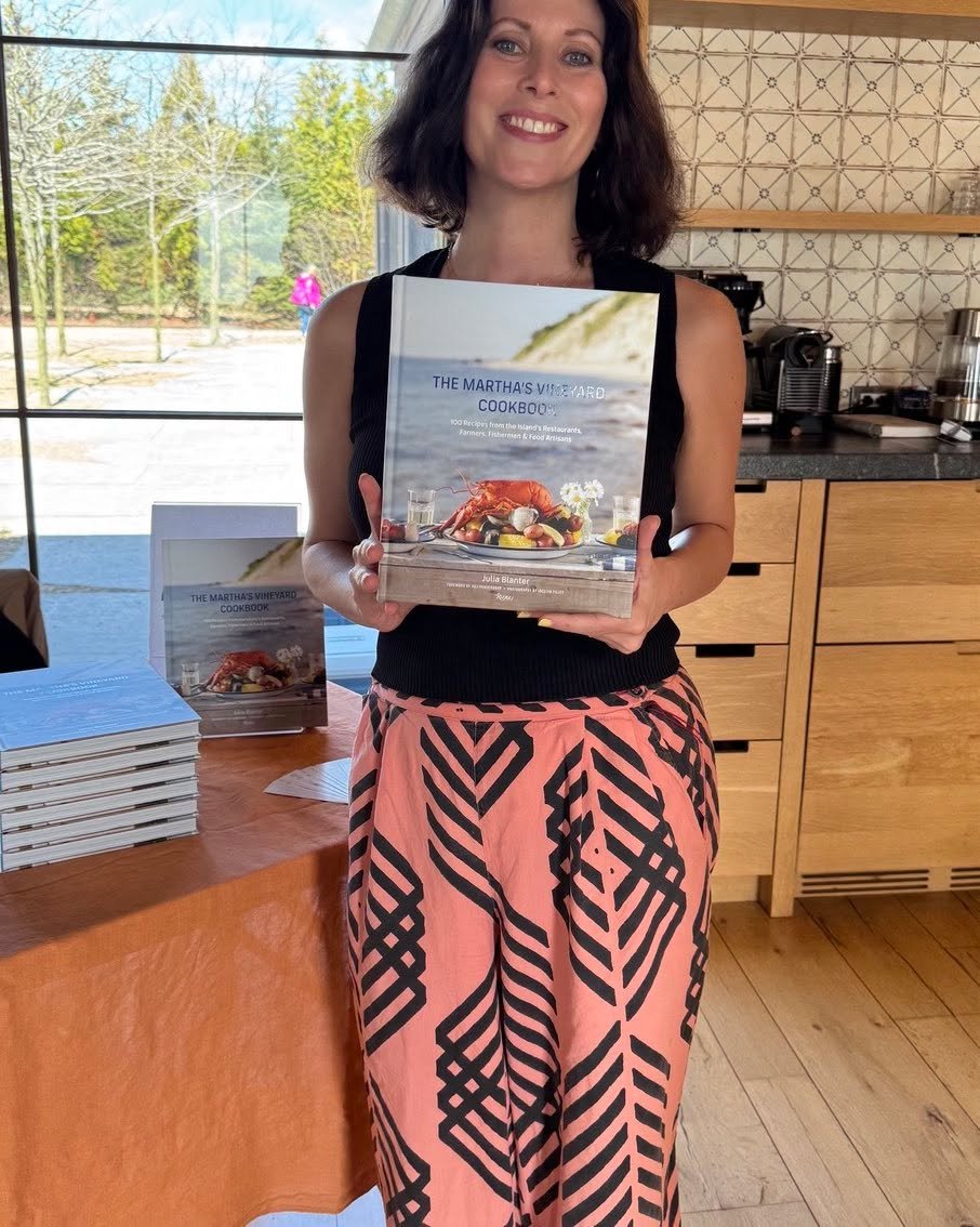 Julia Blanter holds her hit cookbook, &ldquo;The Martha&rsquo;s Vineyard Cookbook&rdquo; at a signing party at Slough Farm. A hundred island chefs contributed.