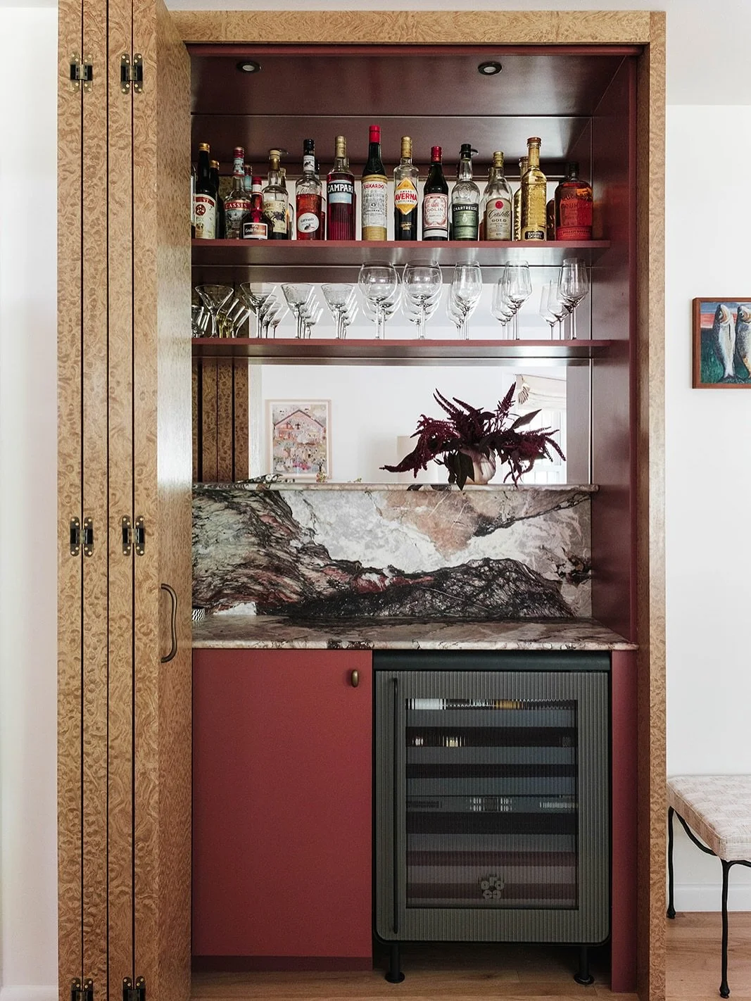 Le minibar! My favorite part of the Sag Harbor project. During the day she&rsquo;s an inconspicuous burl cabinet, but at wine o&rsquo;clock she is everything. Quatre saissons marble looks like colorful crashing waves, and a giant clam vent detail kee
