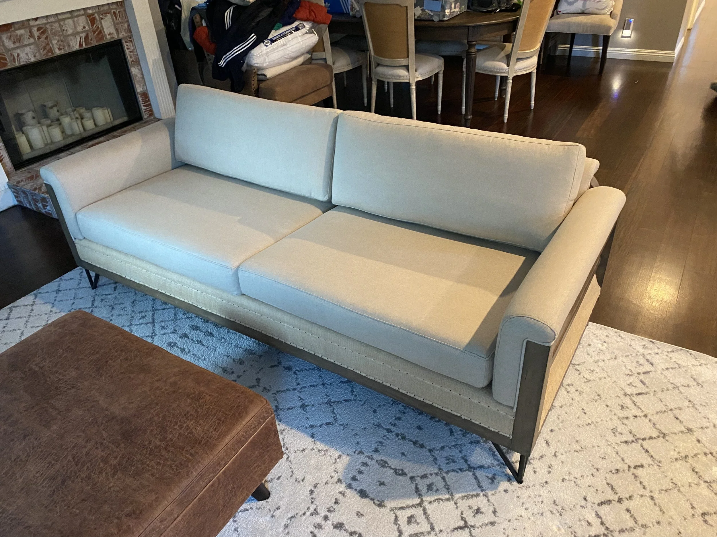 Mid-century style sofa reupholstered with Sunbrella fabric. The cushions have been made with new foam as well. The oak frame has been refinished 