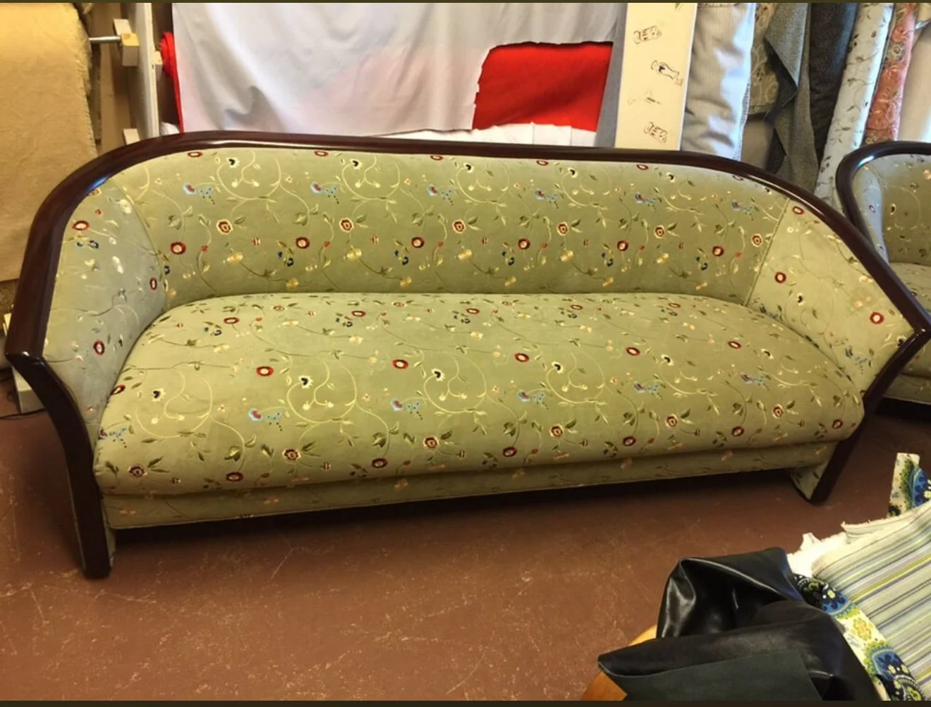 Vintage loveseat upholstered in an embroidered floral suede. 