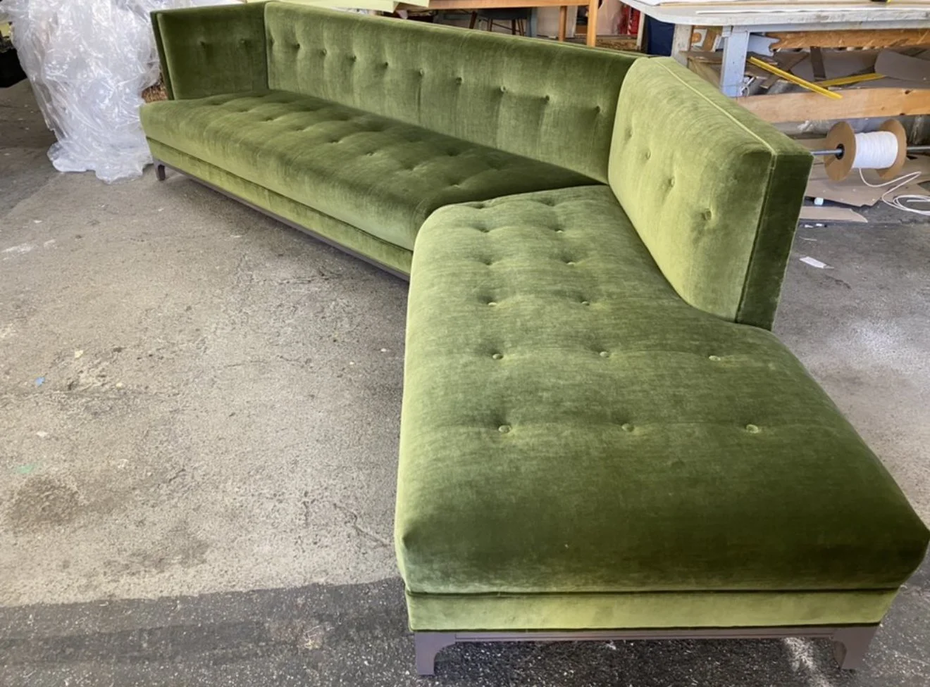 Custom made sofa for a recording studio made with a solid alder wood frame, no sag springs, high resilient foam and upholstered in a green luxury velvet. 
