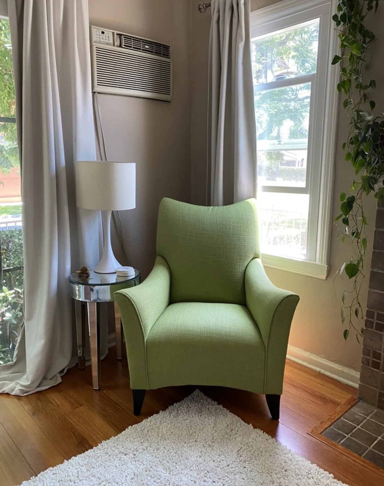 Mid-century armchair reupholstered in a green tweed performance fabric. 