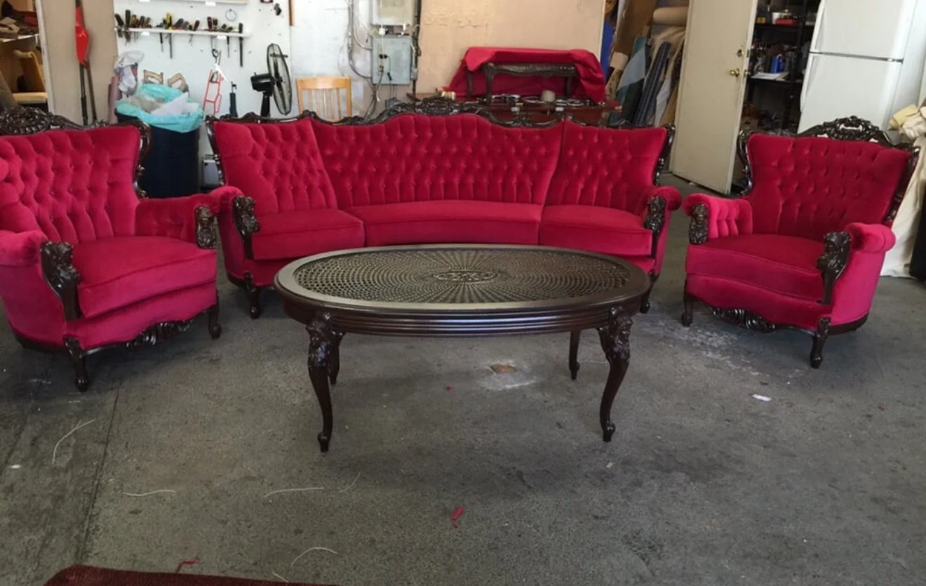 Antique tufted-back sofa and armchair set upholstered in luxury performance red velvet fabric.  