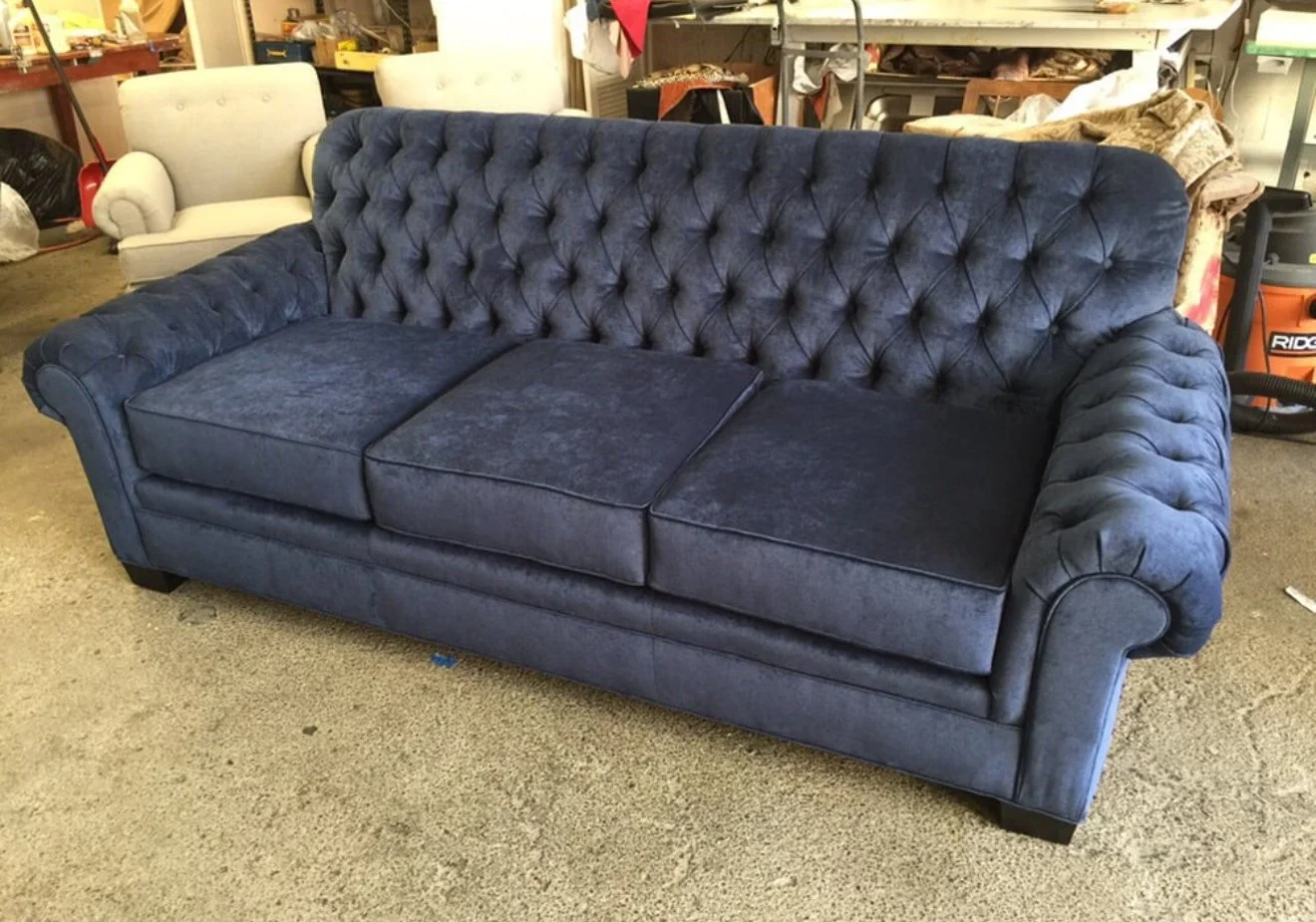 Tufted antique style sofa reupholstered in a grey crush velvet.