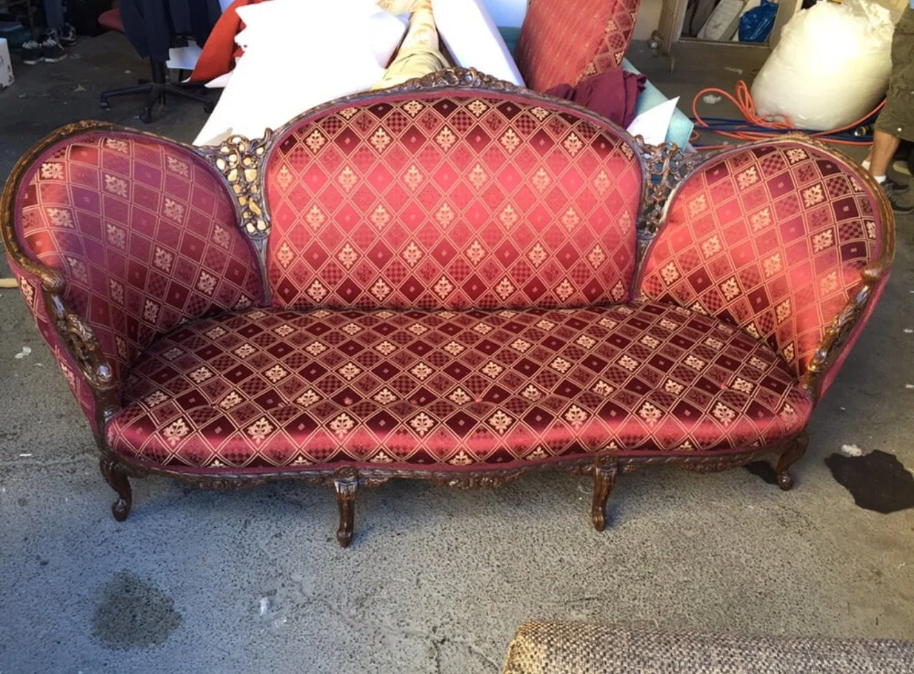 Antique loveseat reupholstered with new paddings and refinished wood. 