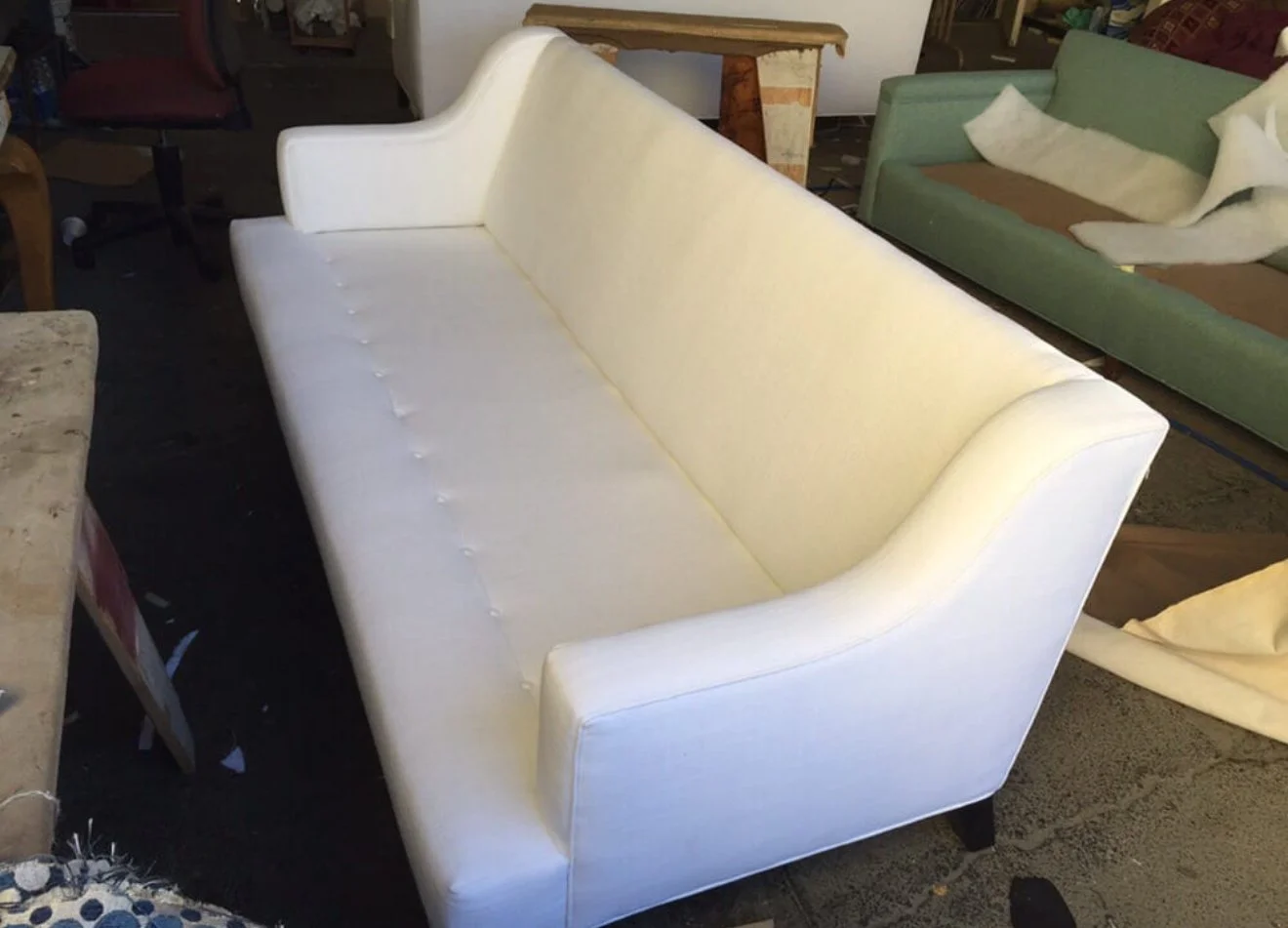 Mid-century sofa reupholstered in a white velvet.