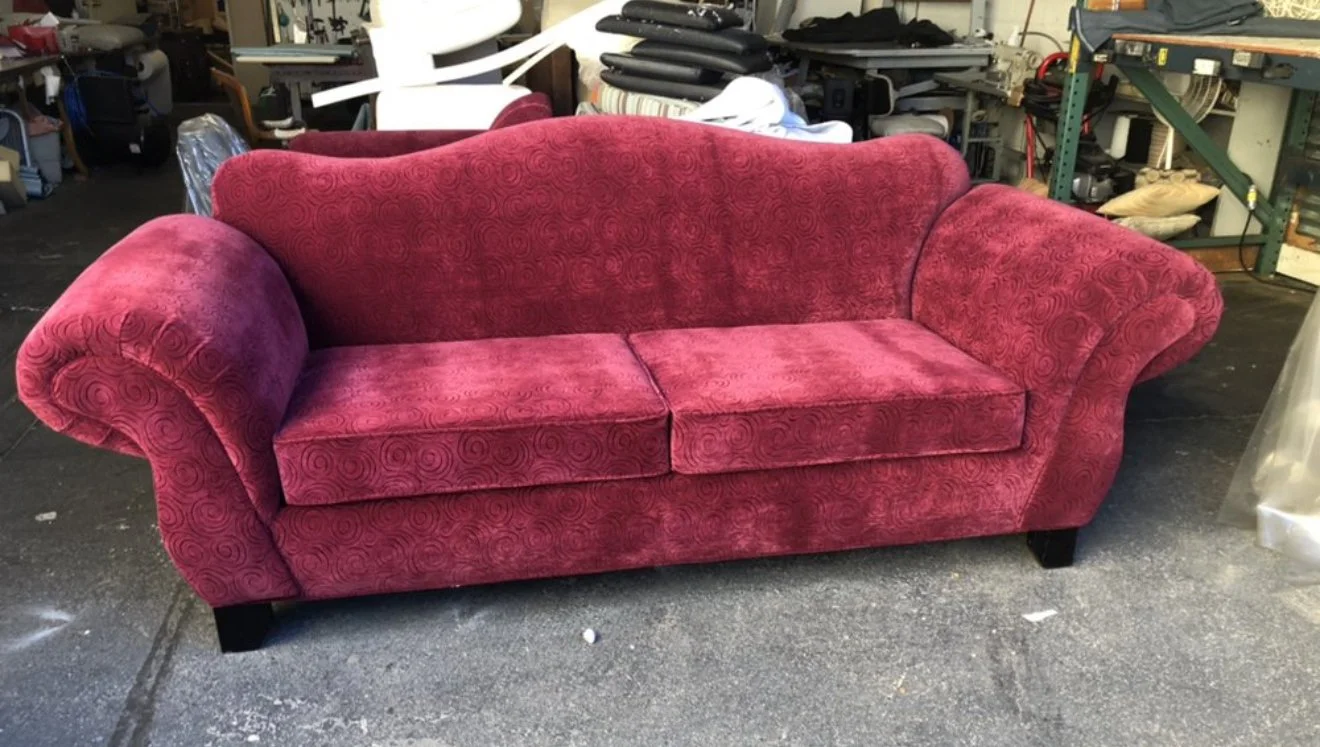 Traditional sofa reupholstered in a red chenille velvet with all new paddings and refinished wood  legs. 