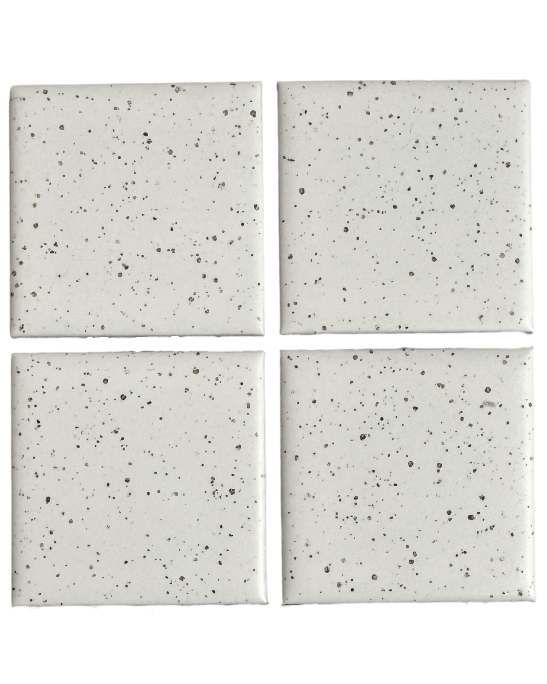 Rasa off-white porcelain mosaic tiles with delicate dark speckling and softly cushioned edges, featuring four square Rasa Block tiles against a larger speckled tile surface.