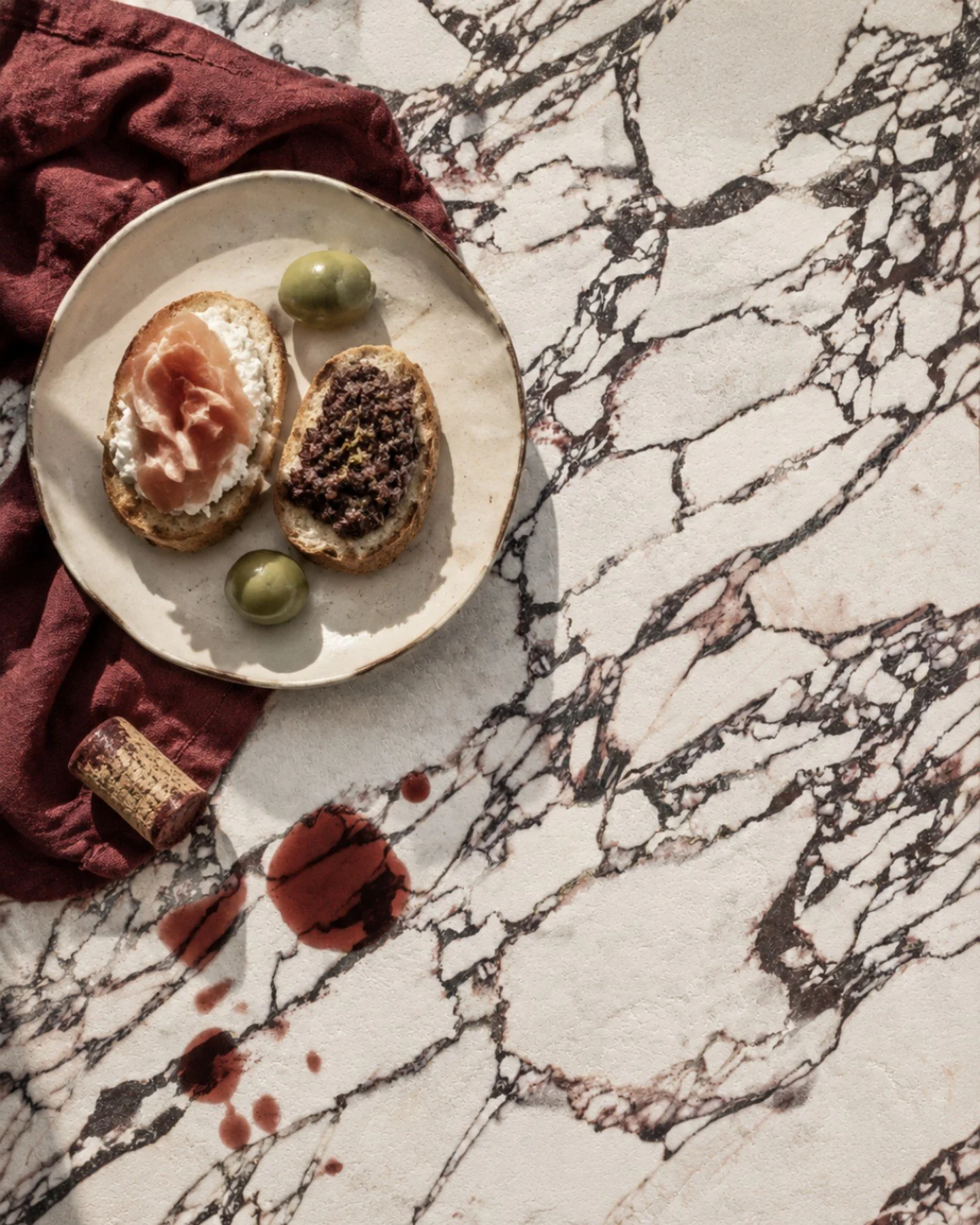 Arabesco Viola has arrived! 

Defined by expressive plum, burgundy and earthy veining across a creamy white base, this 600 x 600mm porcelain tile brings rich colour, movement and character to a space.

Now we're considering what comes next.

We would