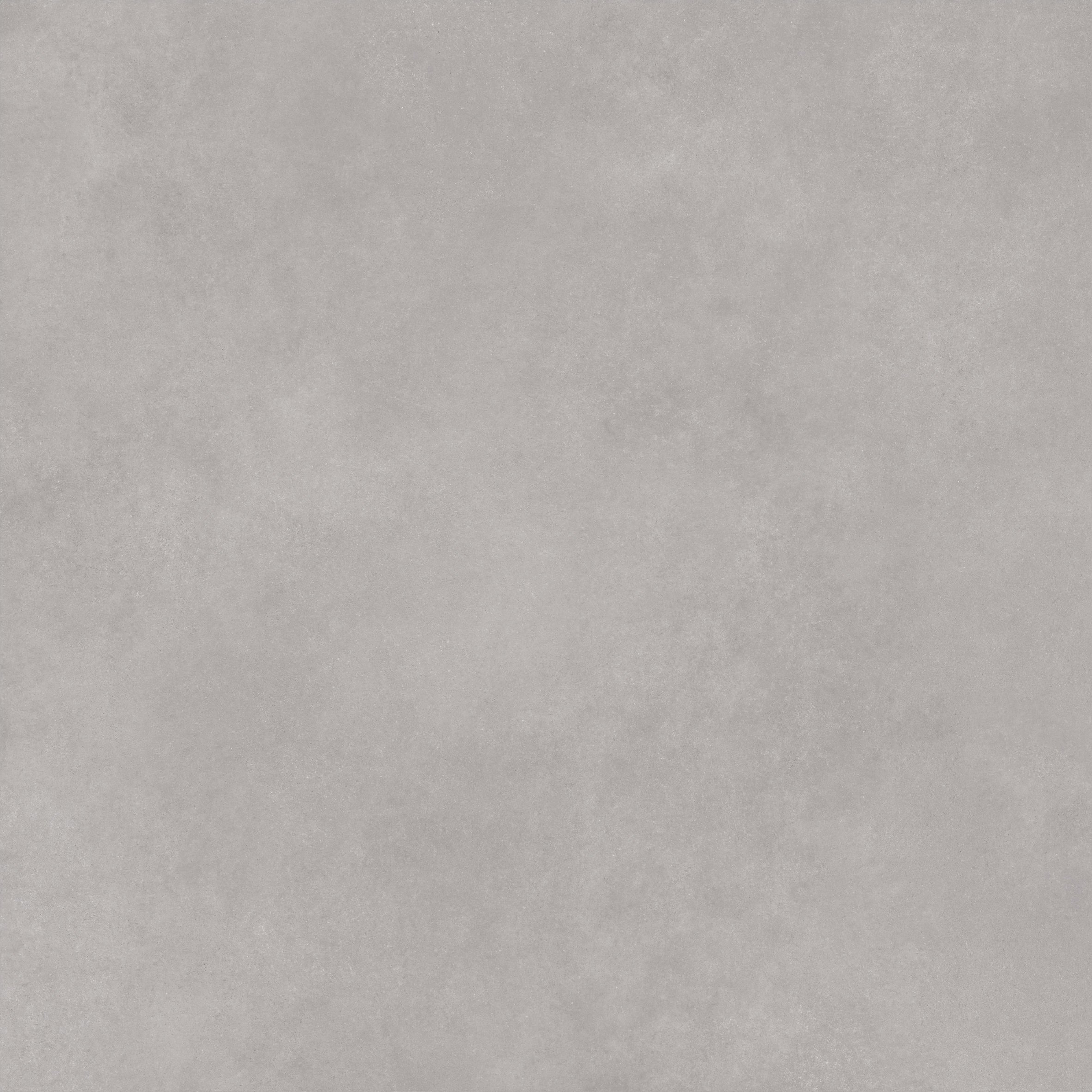 Close-up of Cemento Mist concrete-look porcelain tile showing a soft mid-grey surface with subtle mottling and gentle tonal variation.