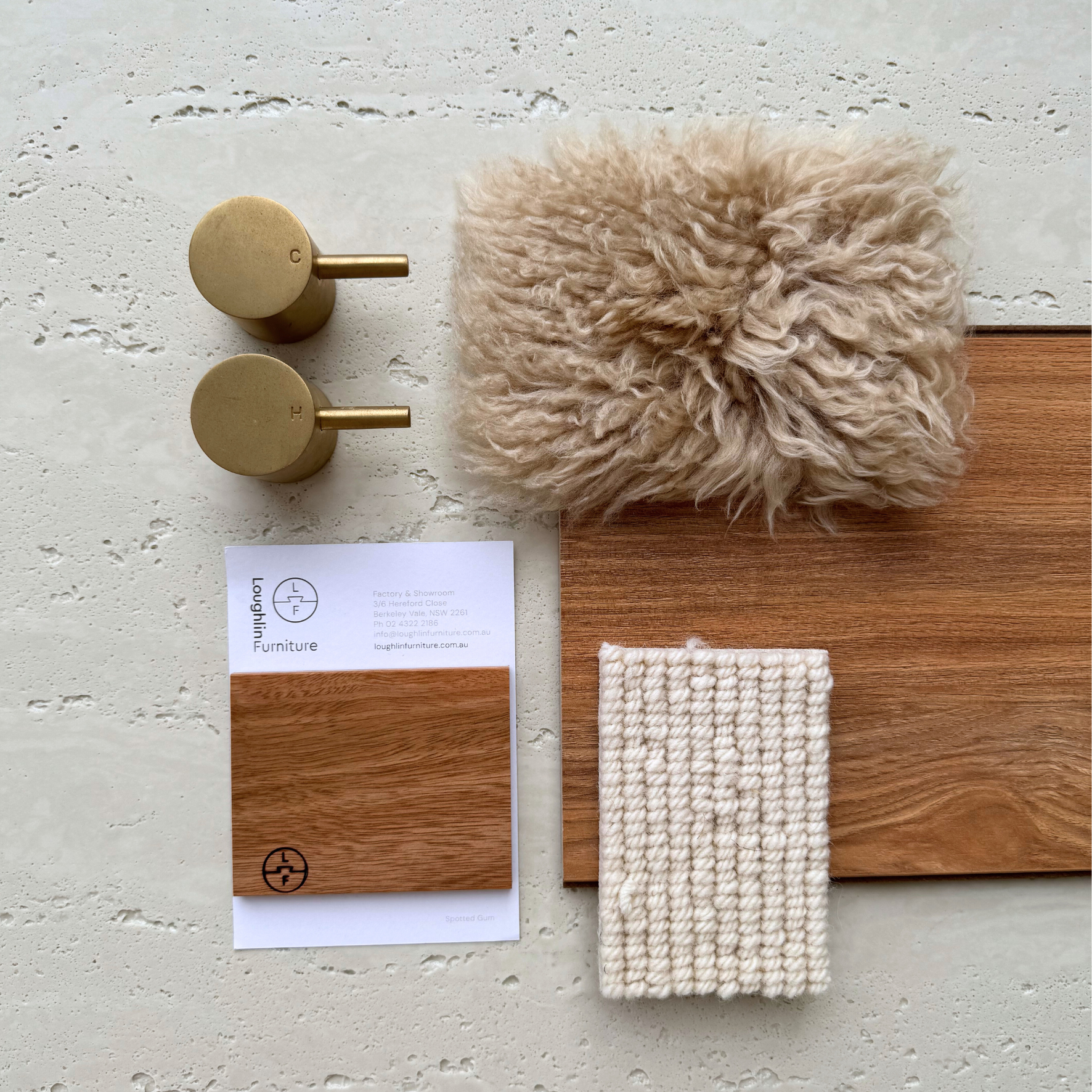 Travertine Classico Linen porcelain tile material flatlay with brass fixtures, warm timber samples, textured fabric swatches and a soft neutral colour palette.
